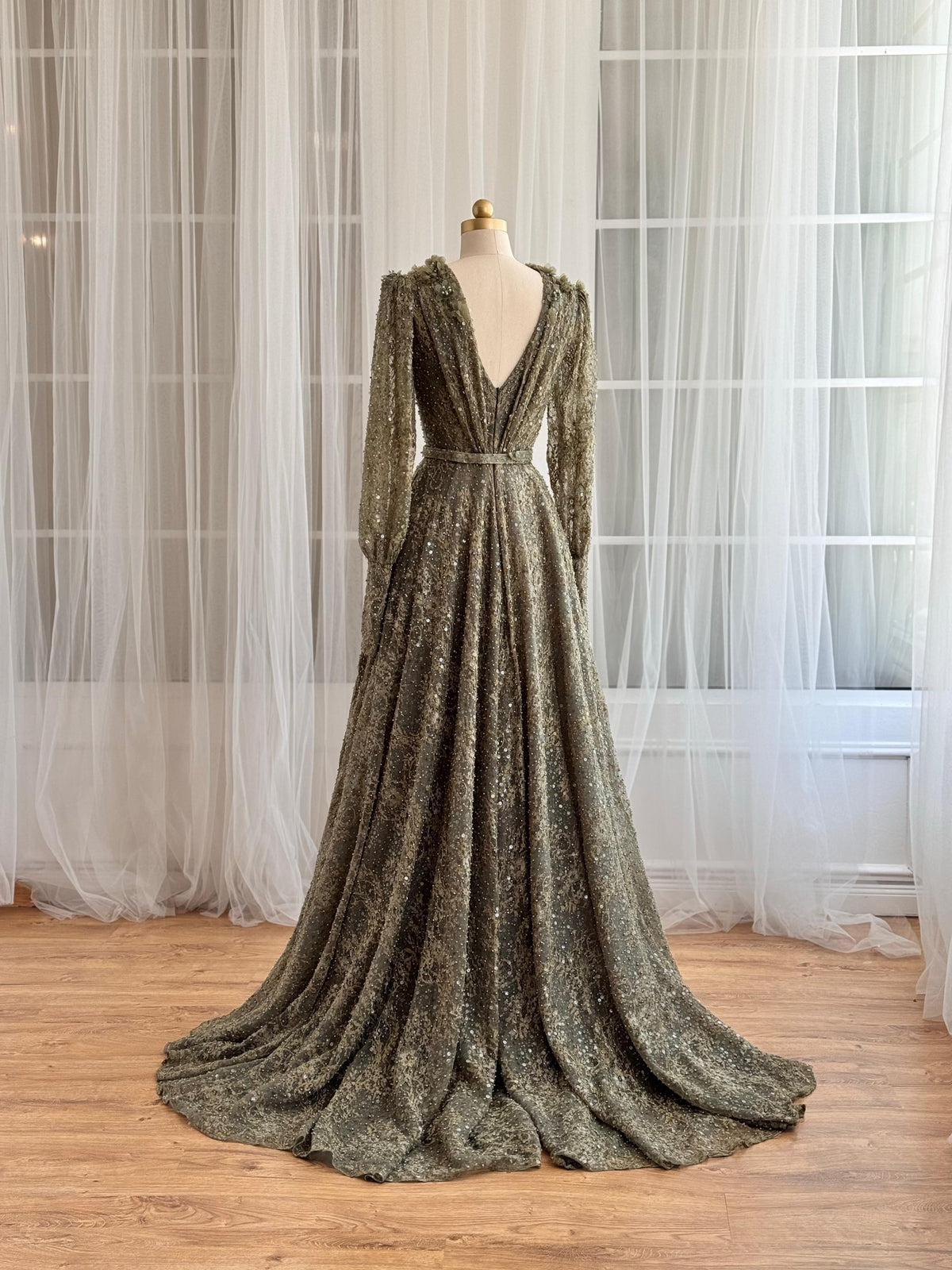 Green A-Line dress with v-neck, belt, long sleeves and embroidery