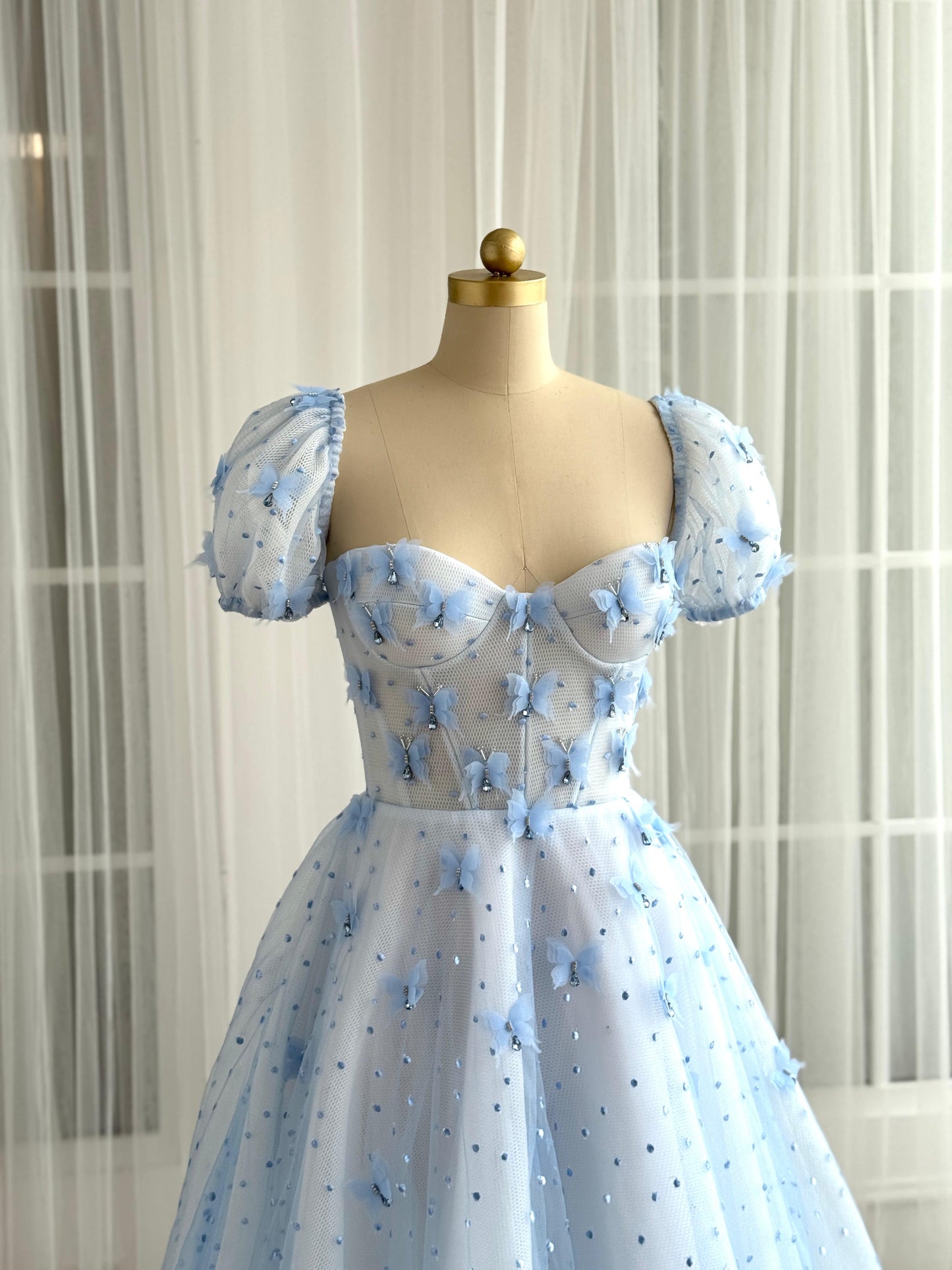 Blue A-Line dress with short sleeves and embroidered butterflies