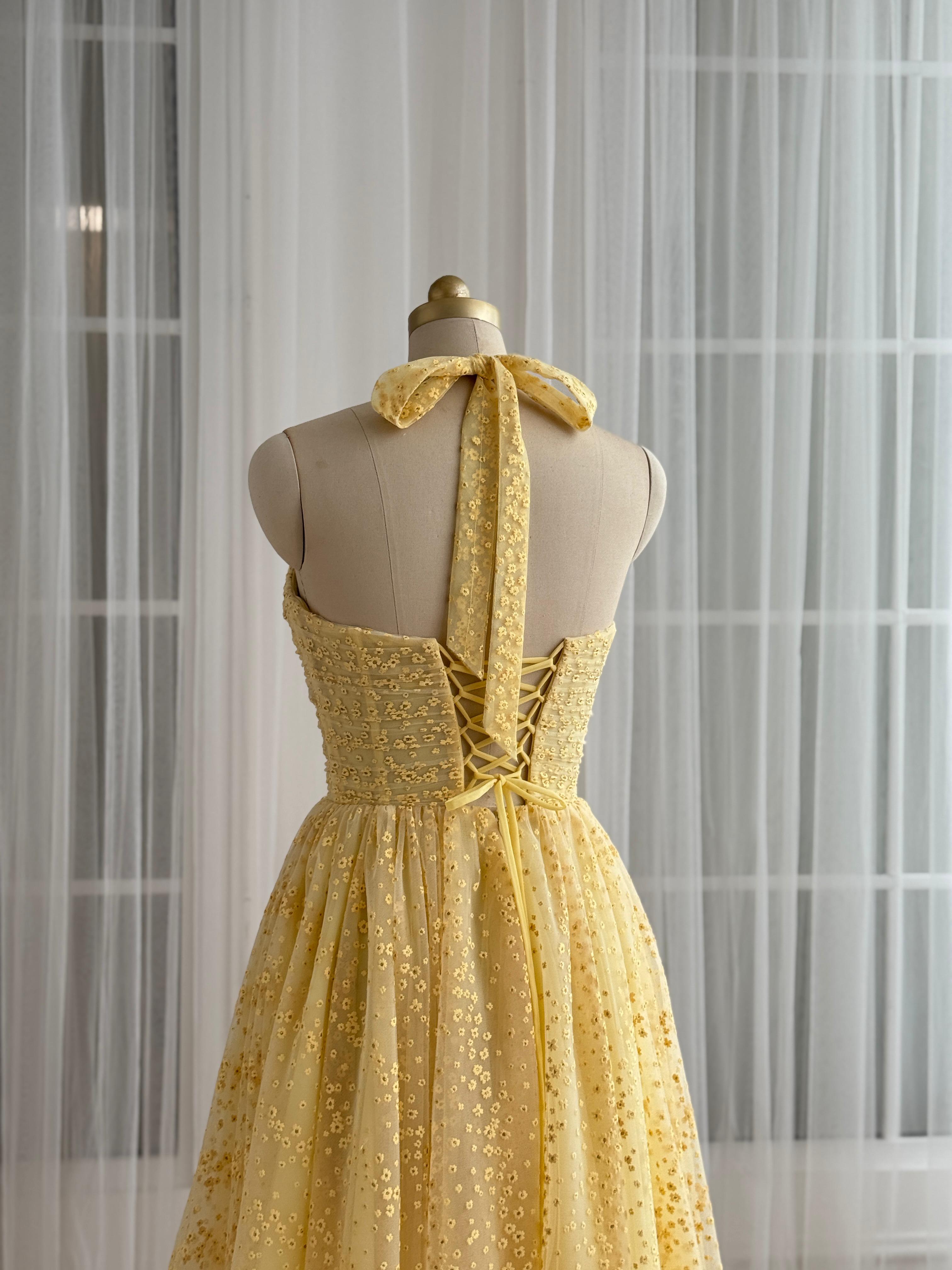 Yellow midi dress with straps and embroidered bow