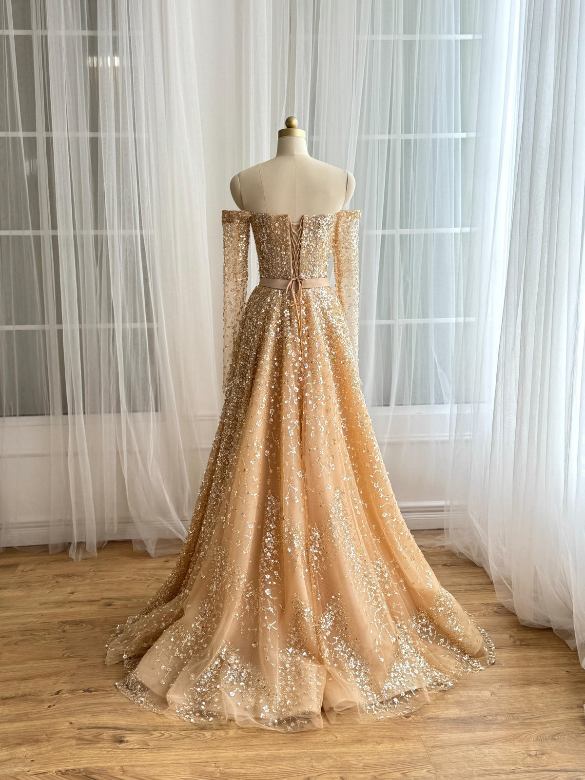 Beige A-Line dress with long off the shoulder sleeves and sequins