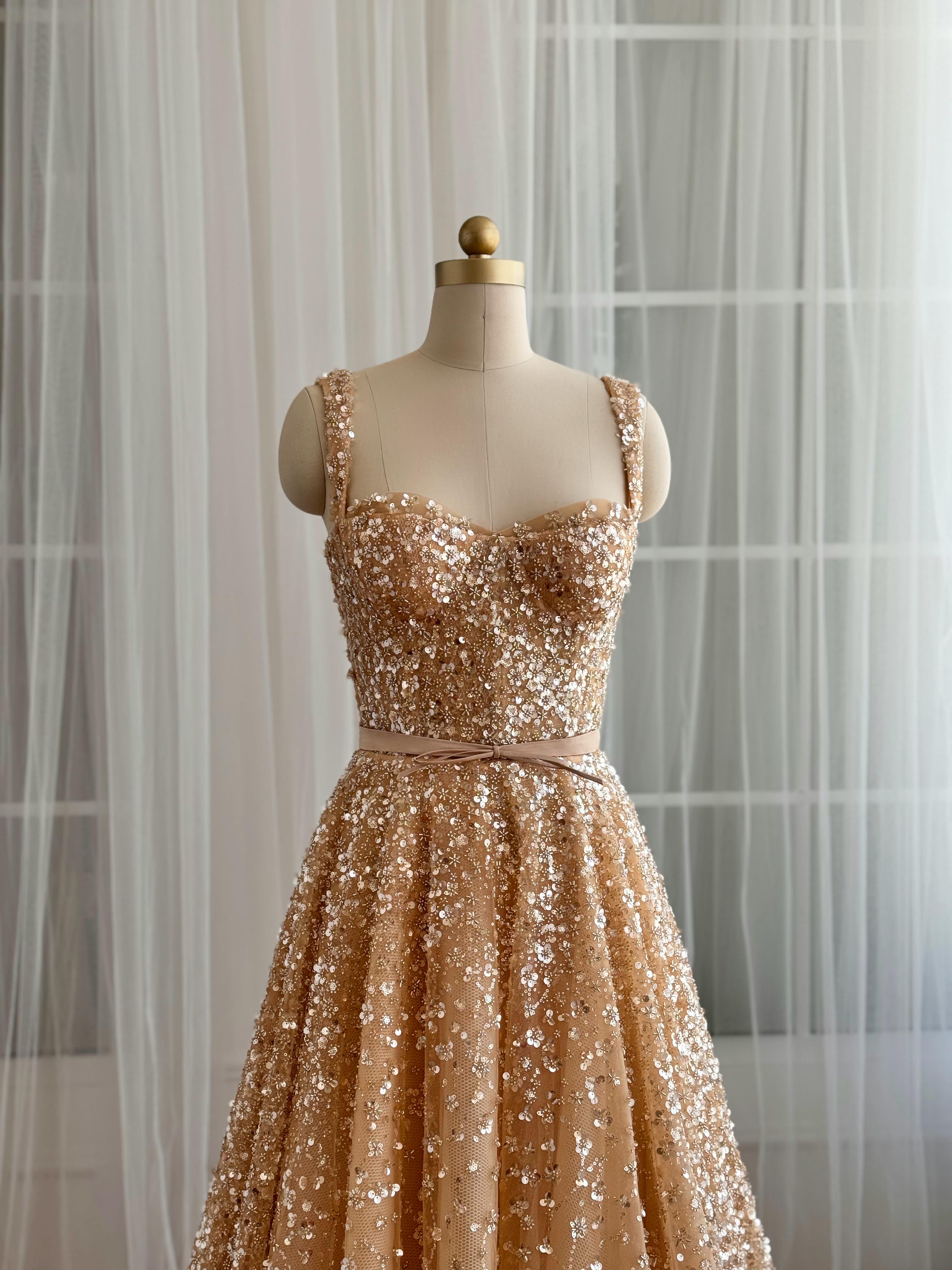 Beige A-Line gown with straps and gold sequins
