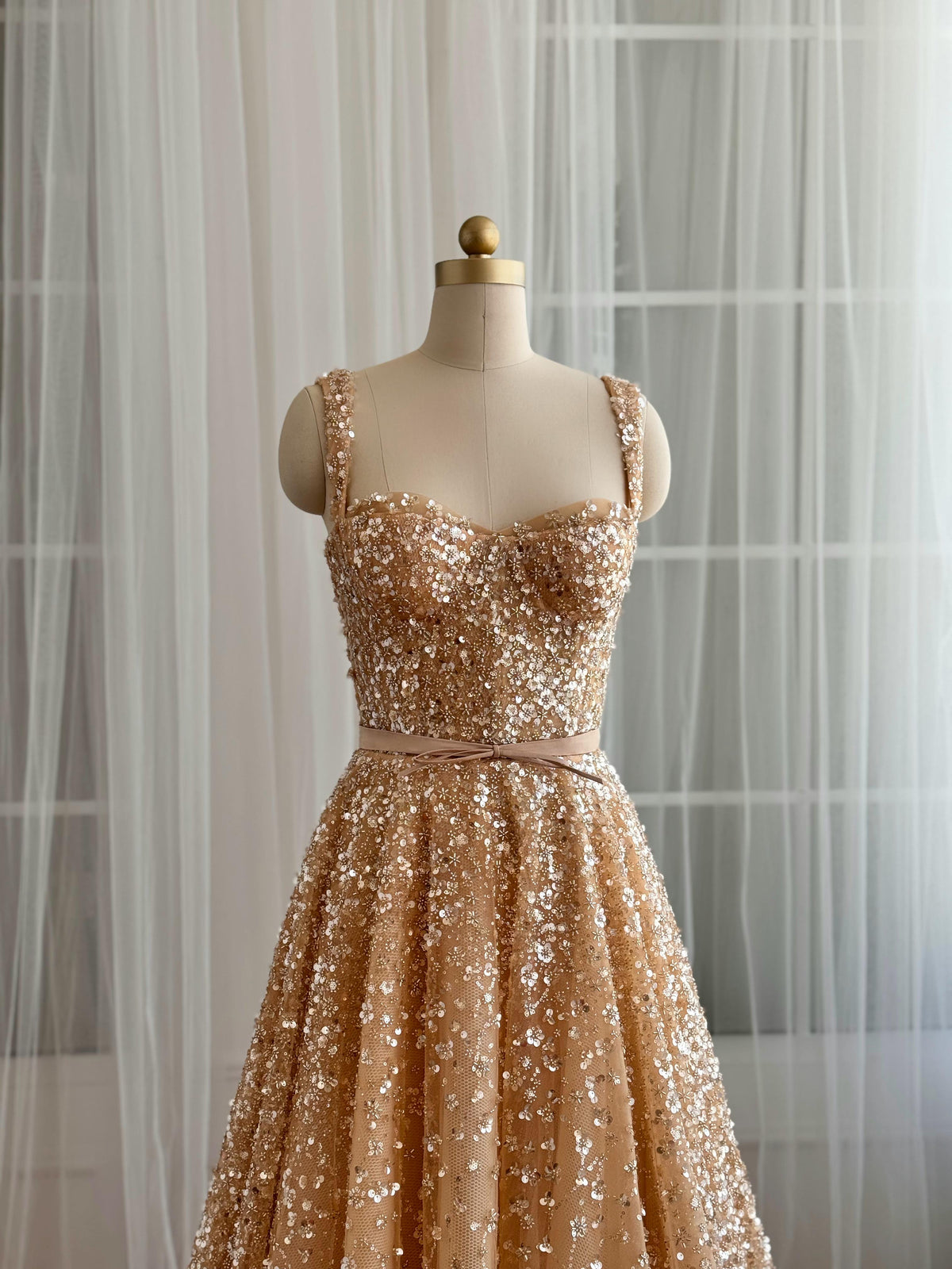 Beige A-Line gown with straps and gold sequins