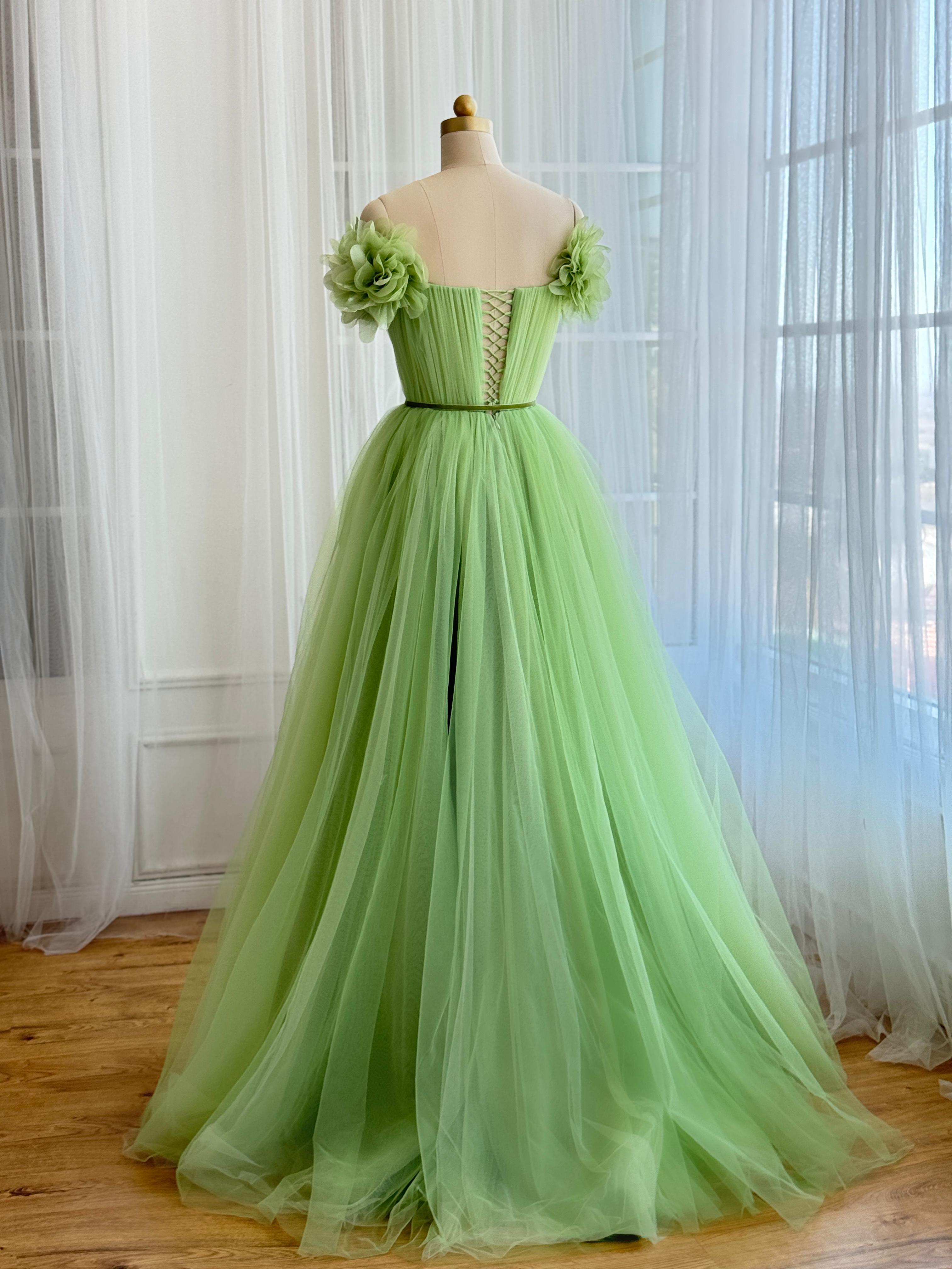 Green A-Line gown with off the shoulder sleeves and embroidered flowers