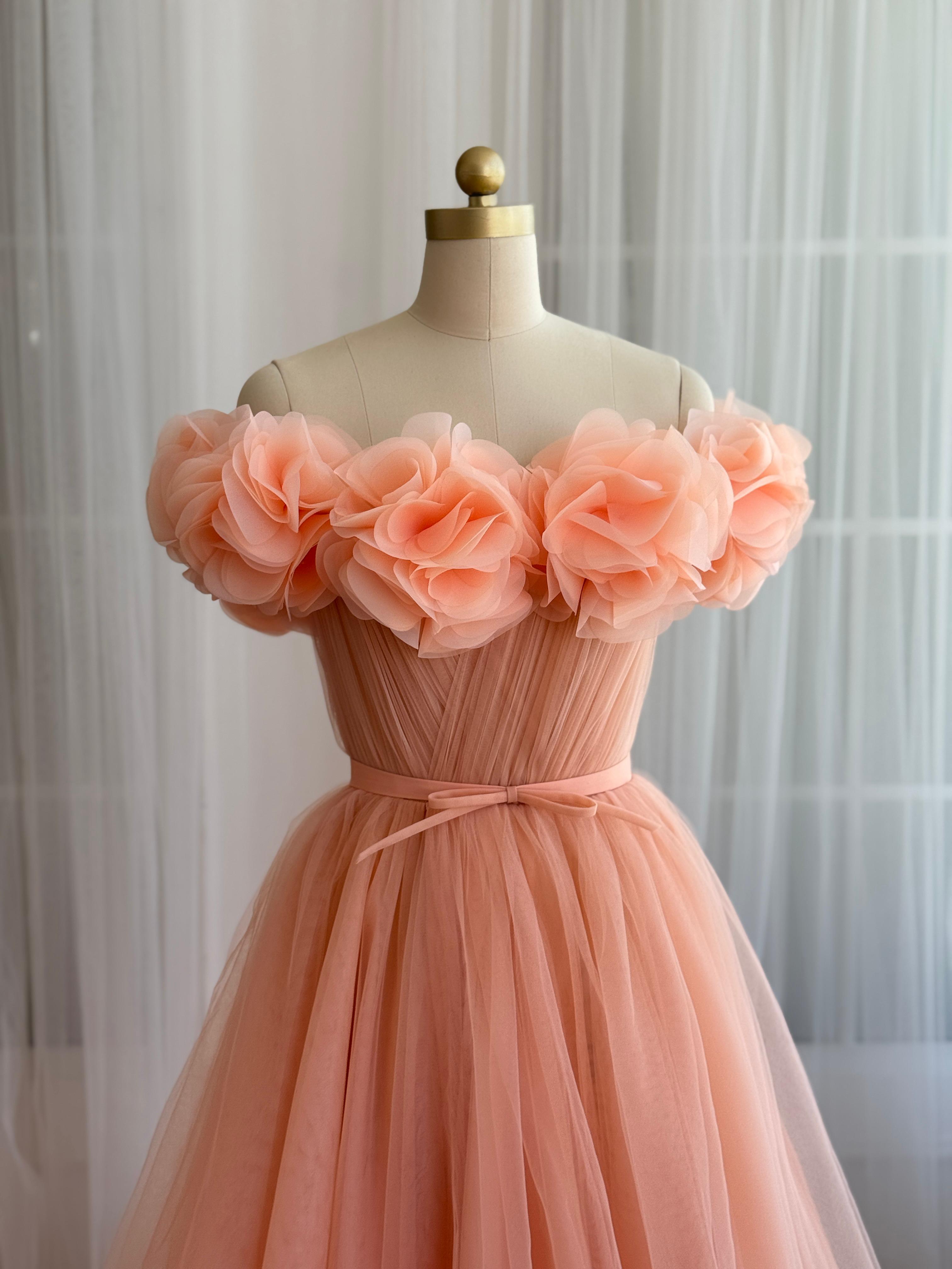 Peach A-Line gown with off the shoulder sleeves and embroidered flowers