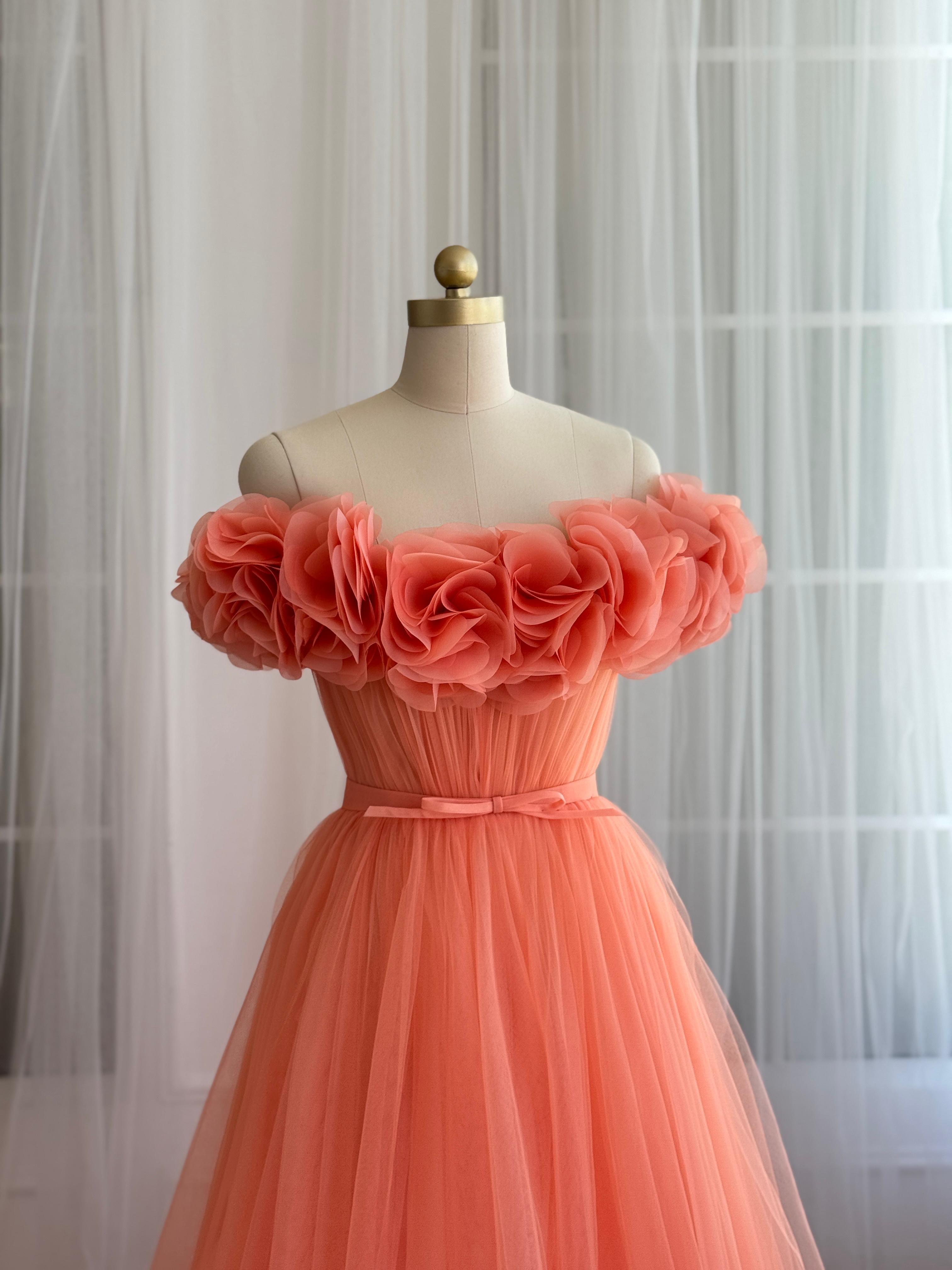 Peach A-Line gown with off the shoulder sleeves and embroidered flowers
