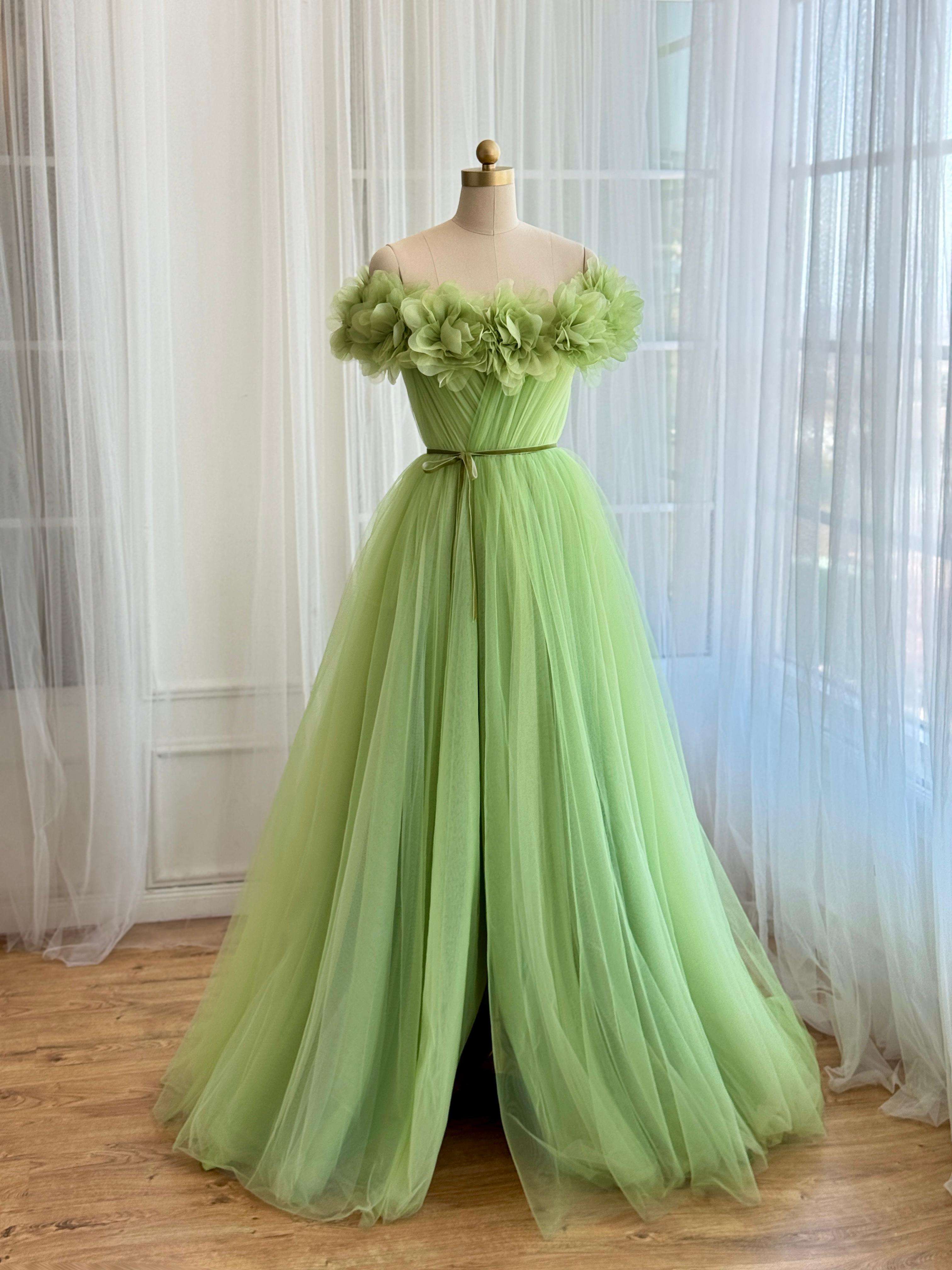 Green A-Line gown with off the shoulder sleeves and embroidered flowers