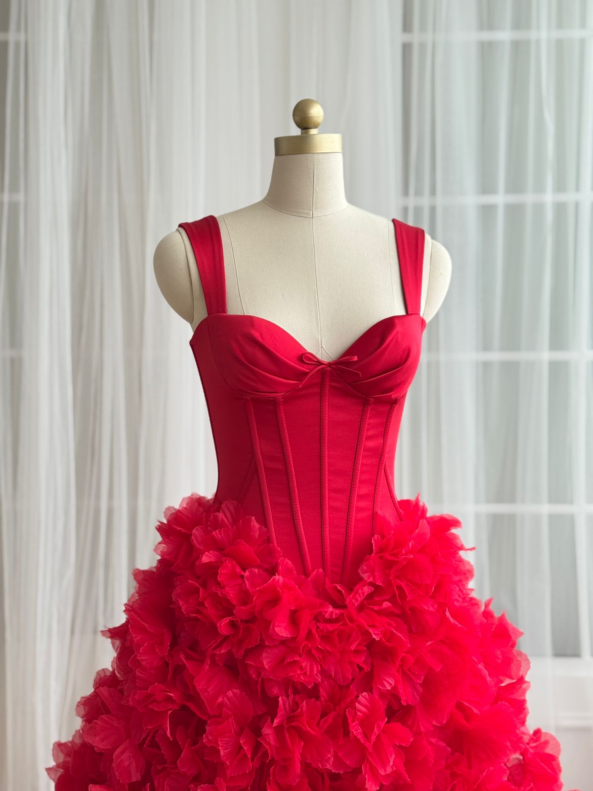 Red A-Line gown with straps and embroidered flowers