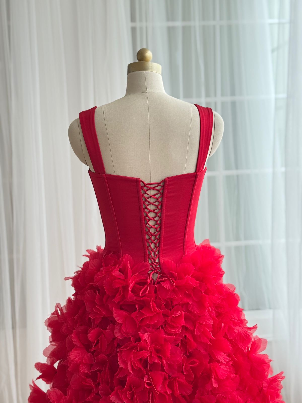 Red A-Line gown with straps and embroidered flowers