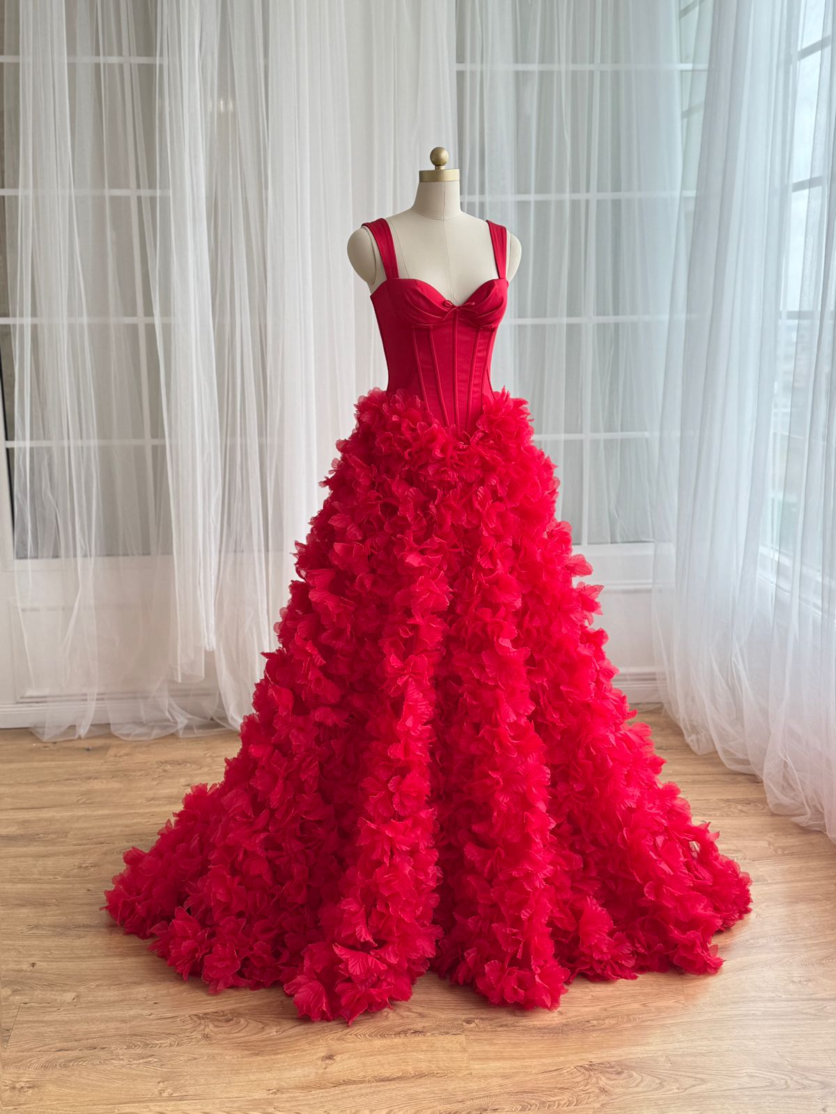 Red A-Line gown with straps and embroidered flowers
