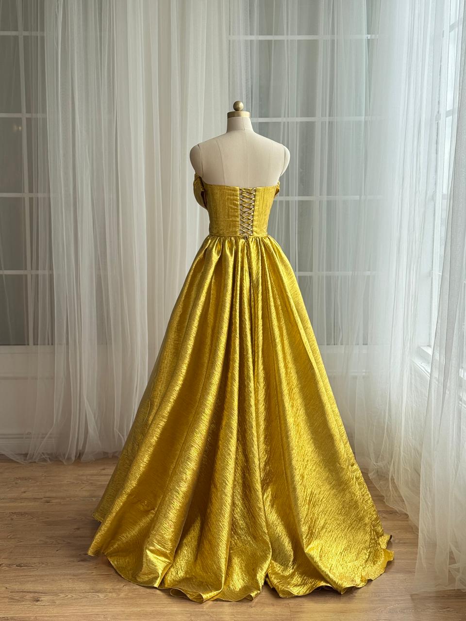 Yellow A-Line gown with no sleeves and v-neck