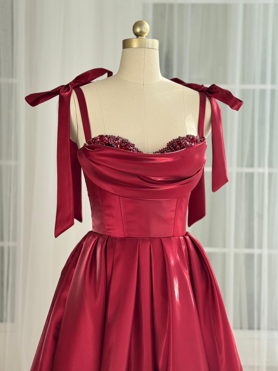 Red midi dress with bow straps and beaded trim