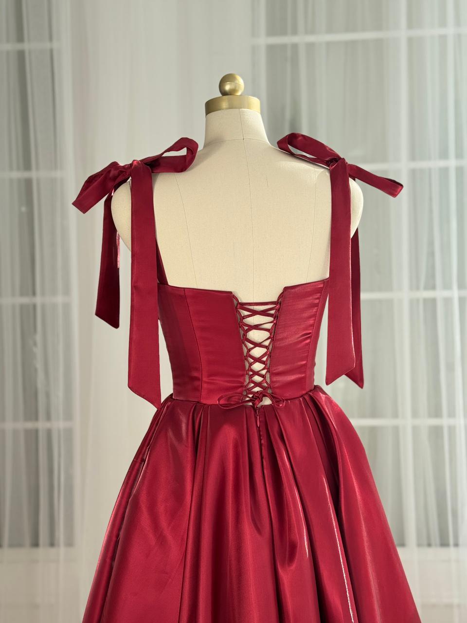 Red midi dress with bow straps and beaded trim