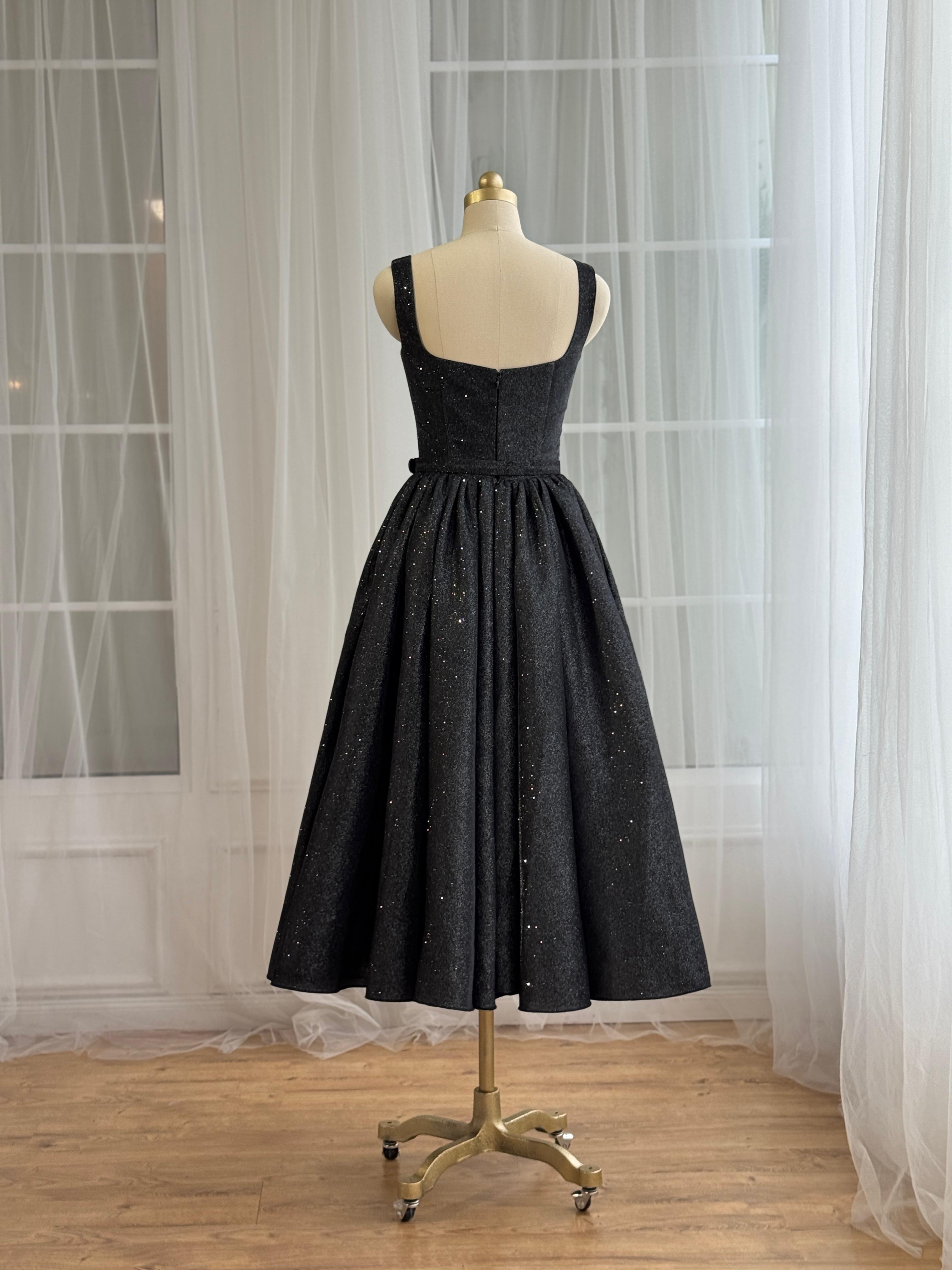 Black midi dress with straps, belt and sparkly fabric