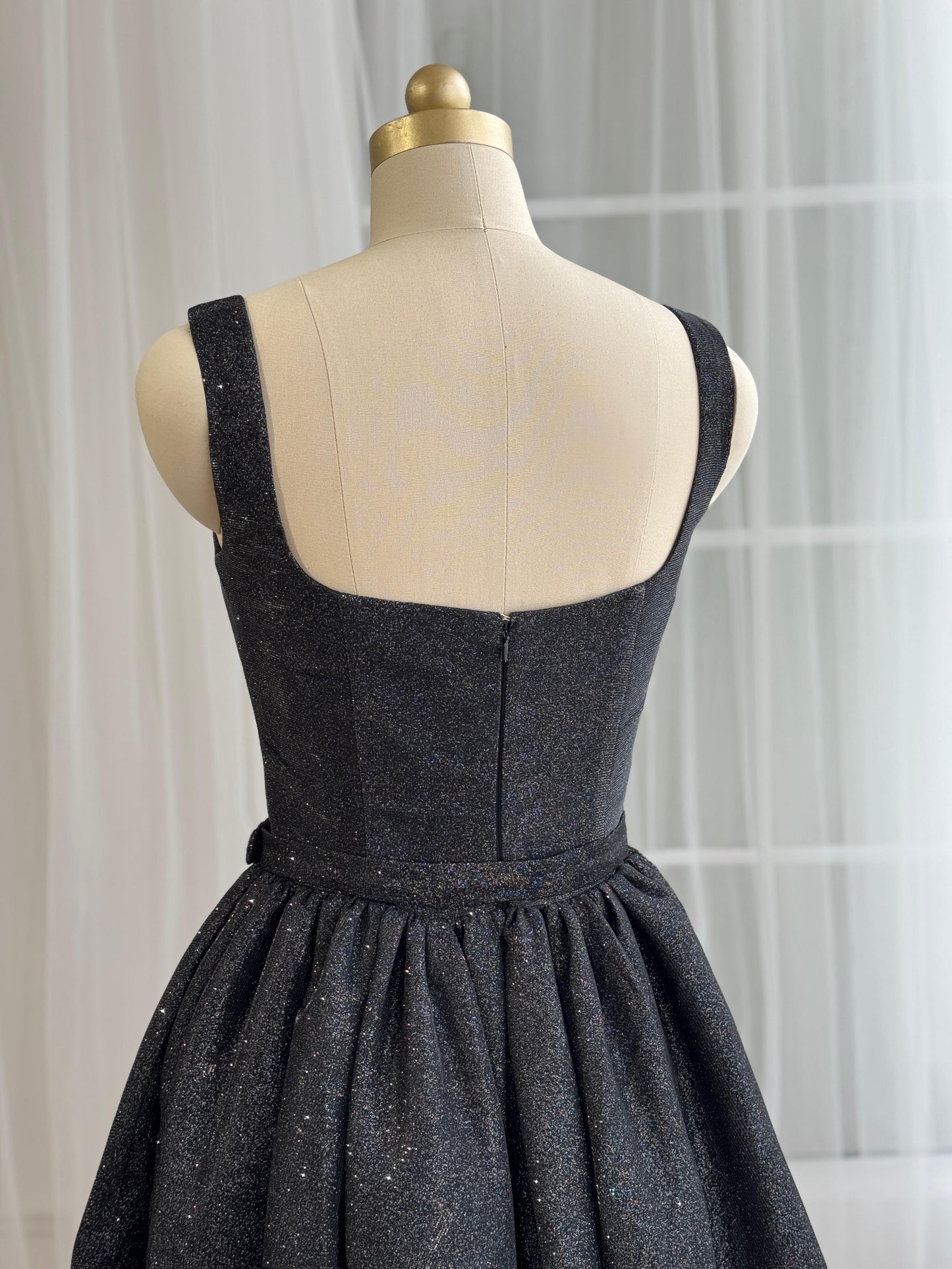 Black midi dress with straps, belt and sparkly fabric