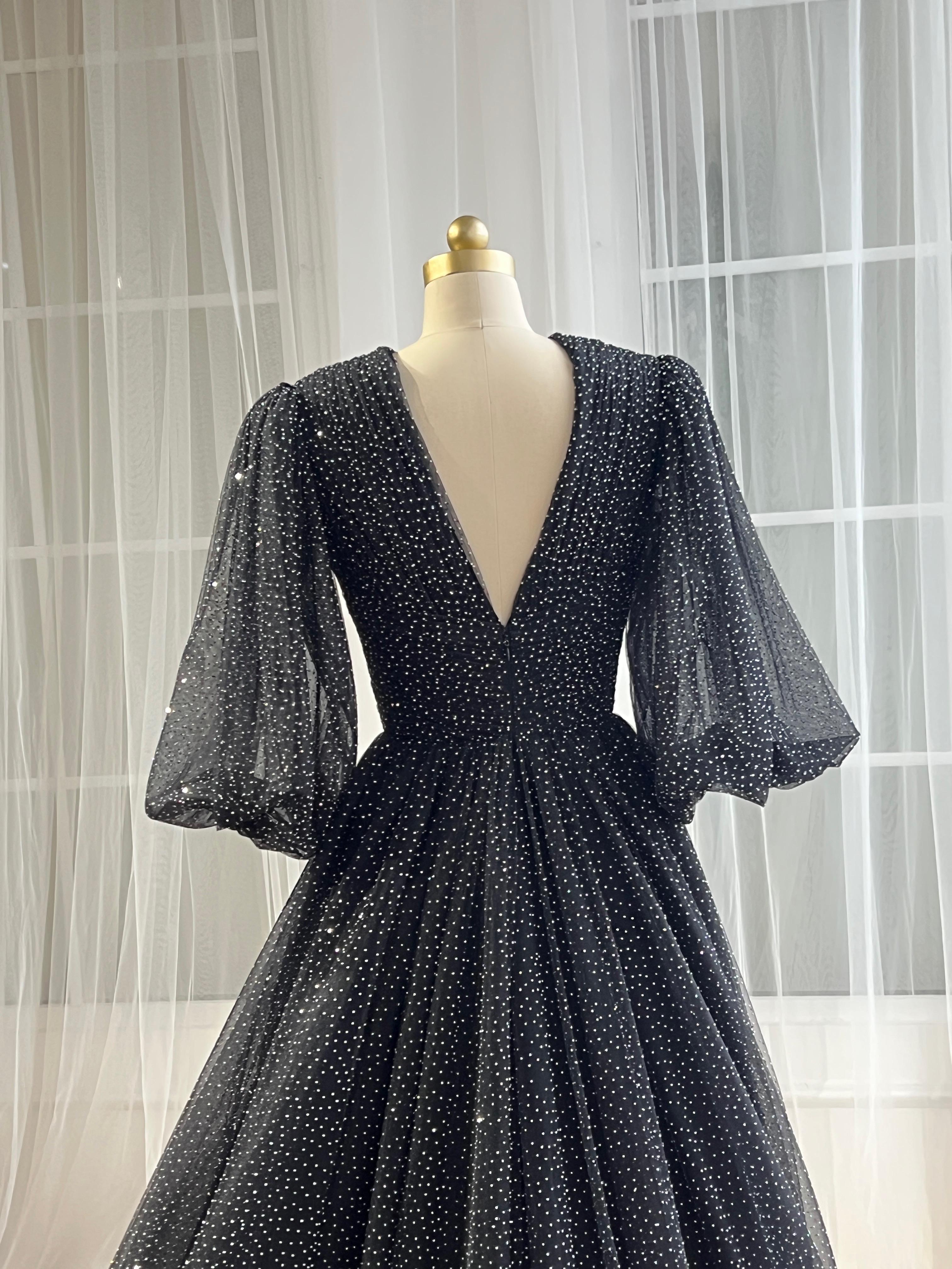 Black beaded A-Line gown with v-neck and long sleeves