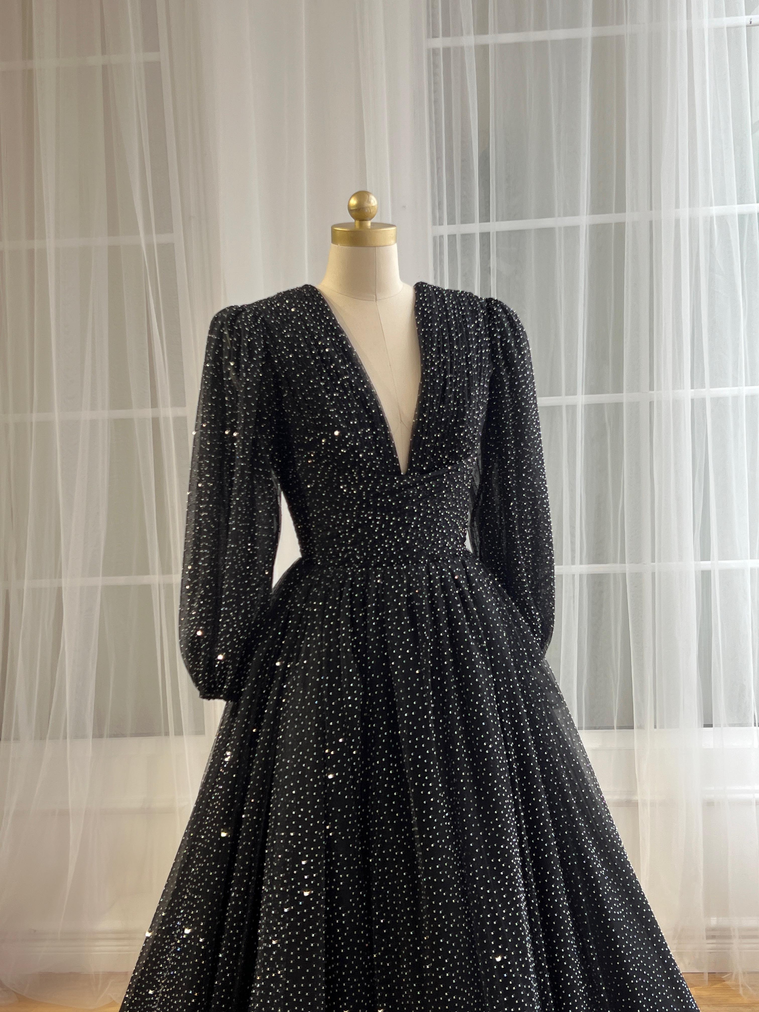 Black beaded A-Line gown with v-neck and long sleeves