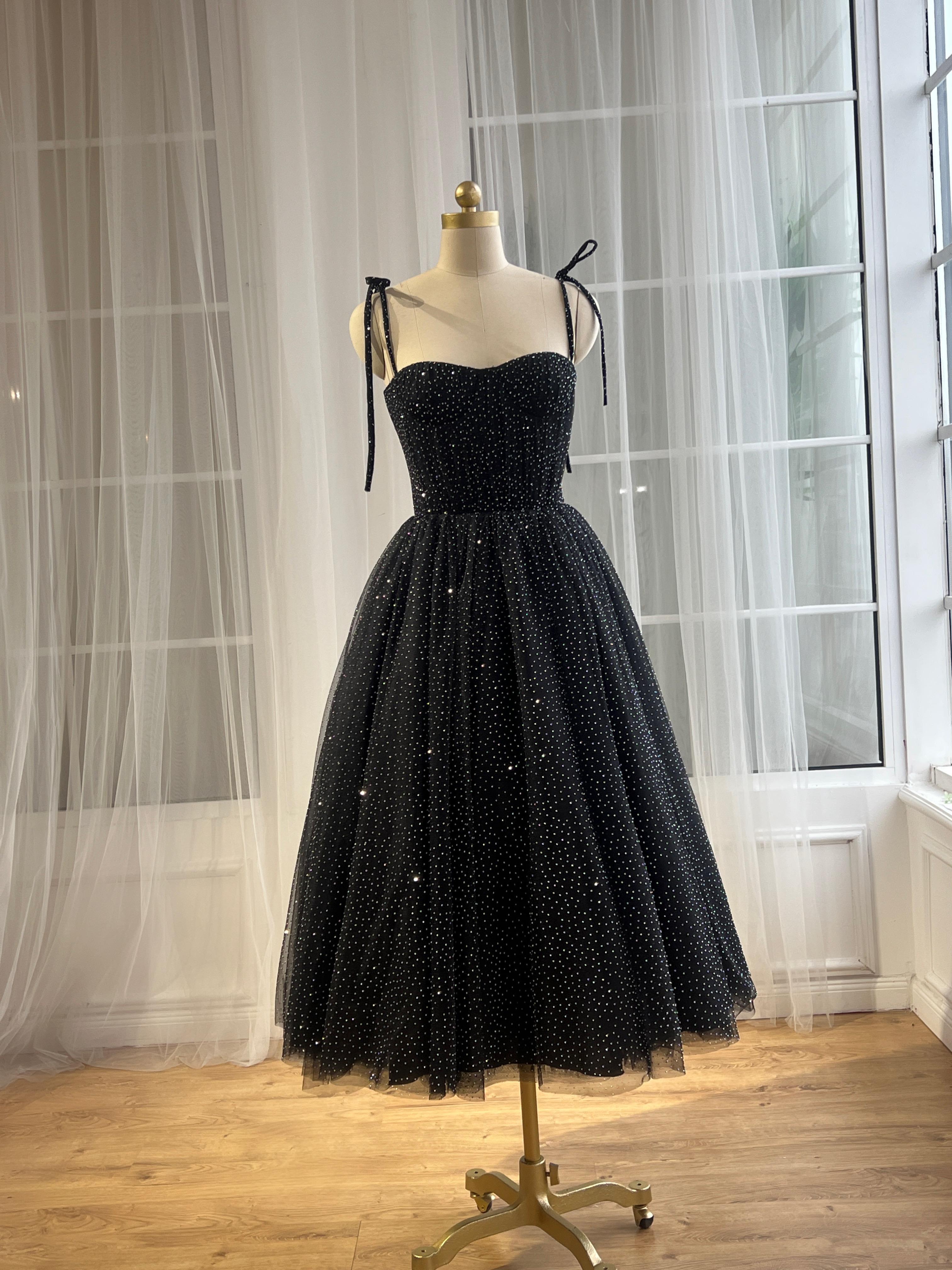 Black midi dress with spaghetti straps and beading fabric