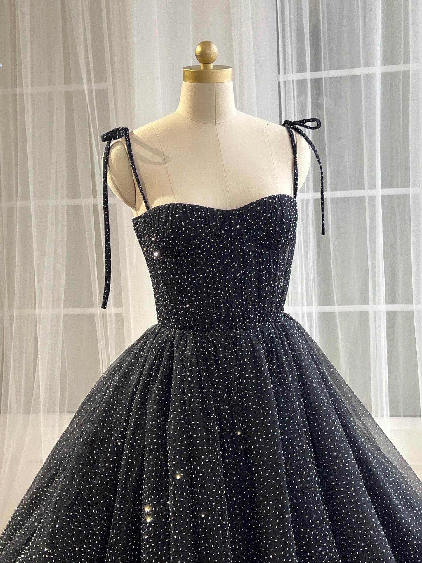 Black midi dress with spaghetti straps and beading fabric