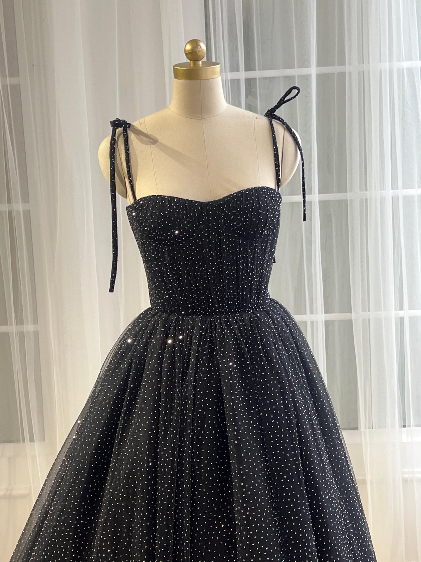 Black midi dress with spaghetti straps and beading fabric