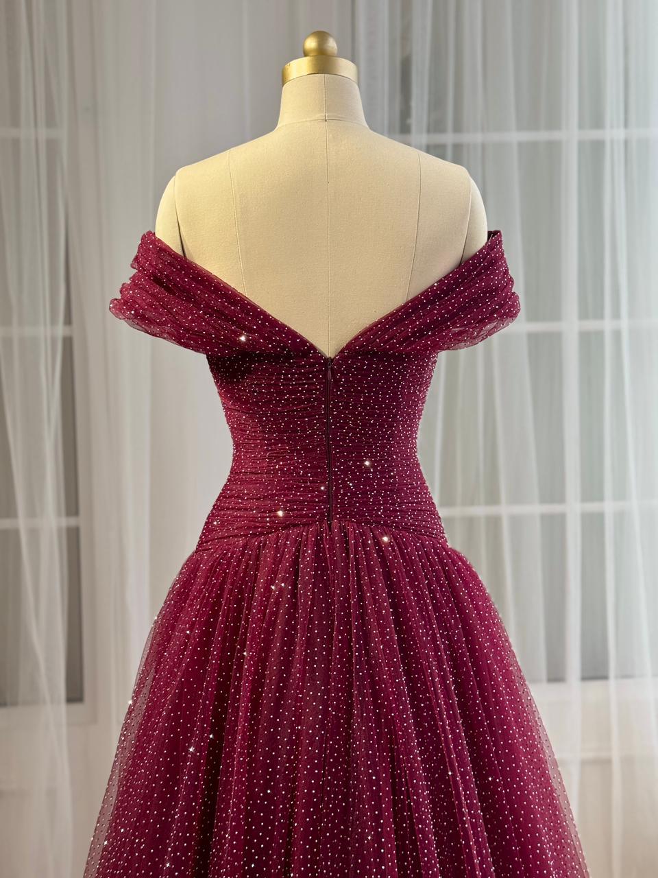 Red A-Line gown with off the shoulder sleeves and beading