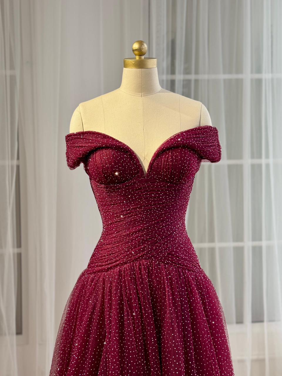 Red A-Line gown with off the shoulder sleeves and beading