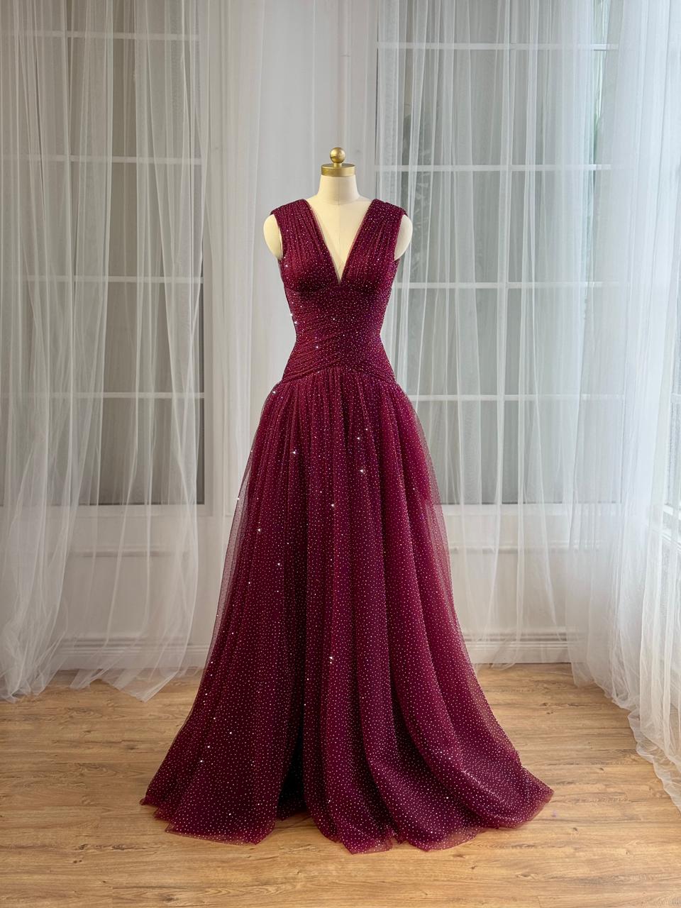 Red A-Line gown with beading, v-neck and no sleeves