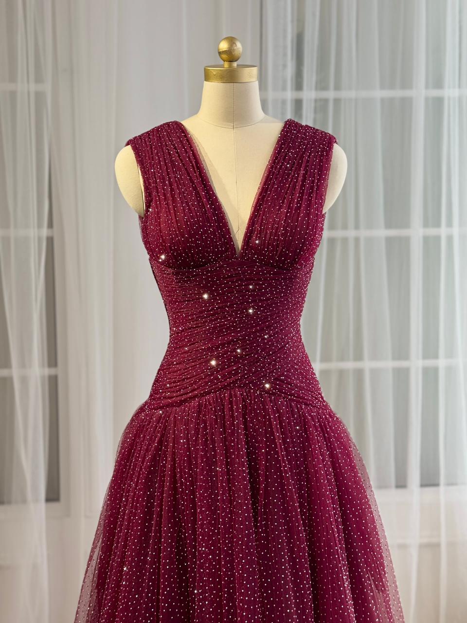 Red A-Line gown with beading, v-neck and no sleeves