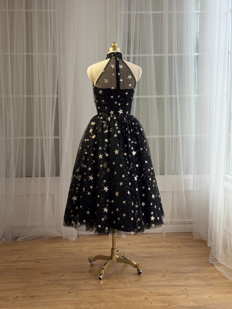 Black midi dress with starry fabric and no sleeves