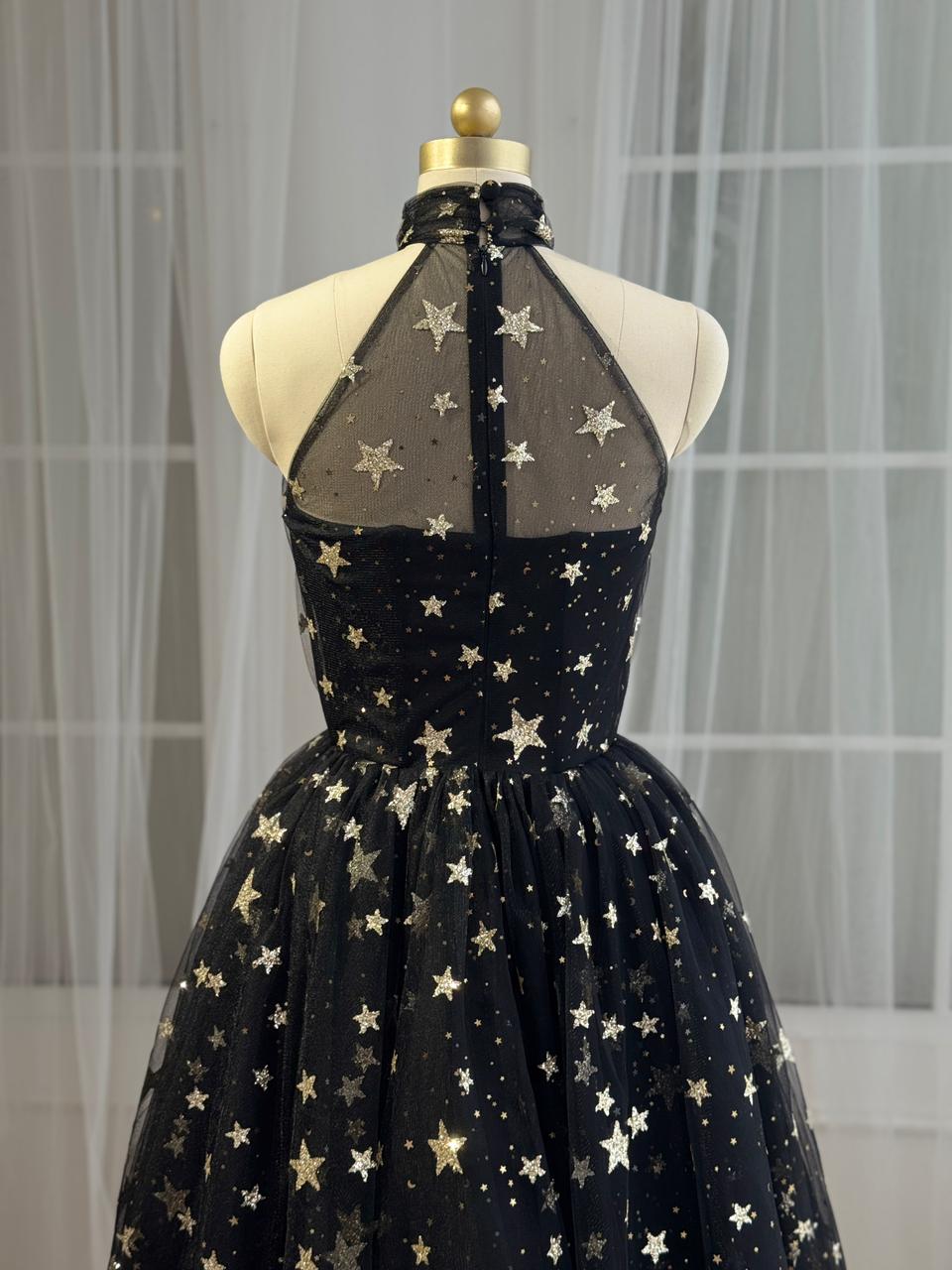 Black midi dress with starry fabric and no sleeves