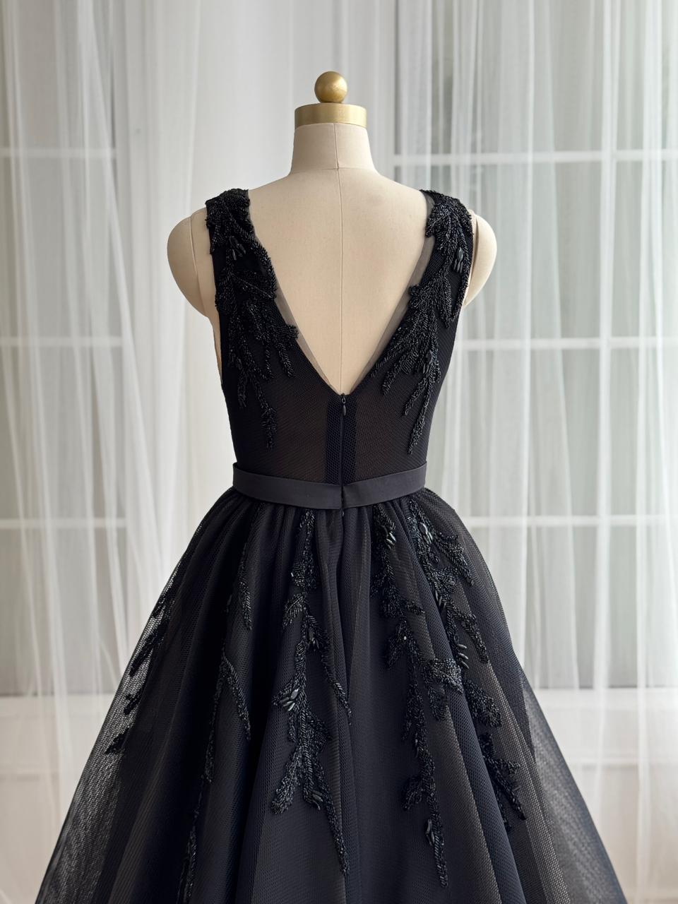 Black A_Line gown with overskirt, v-neck, embroidery and no sleeves