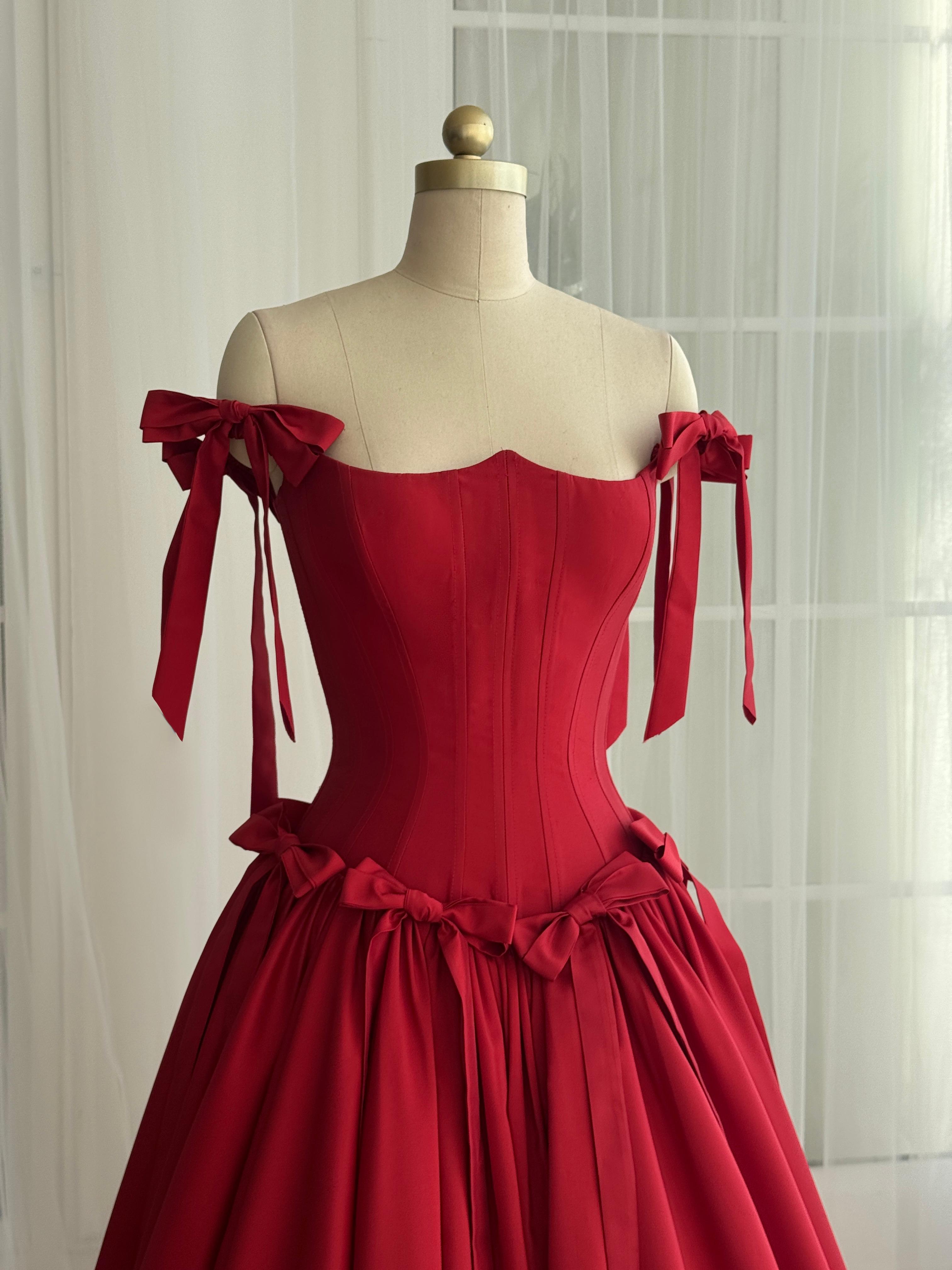 Red A-Line dress with off the shoulder sleeves and embroidered bows