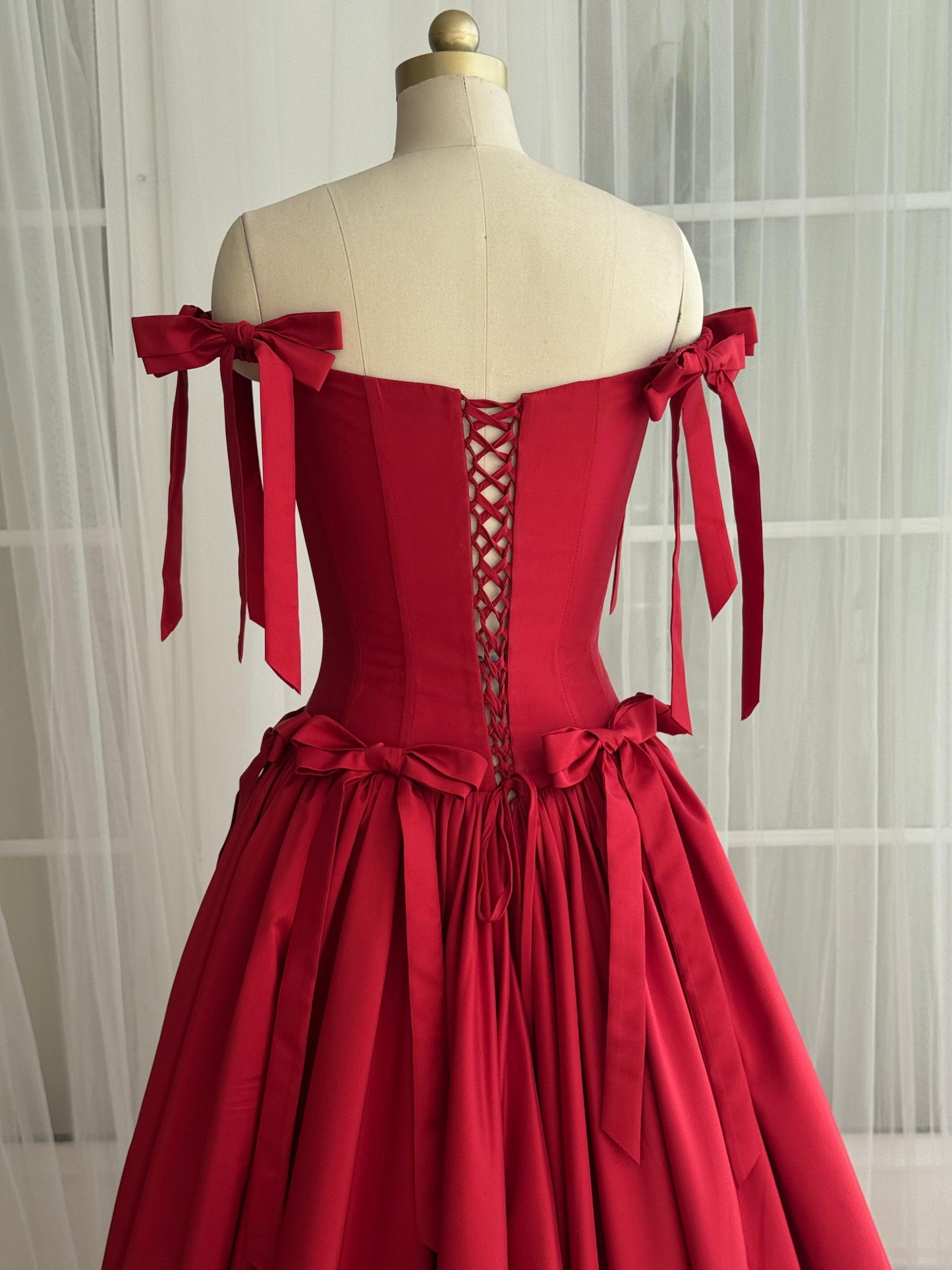 Red A-Line dress with off the shoulder sleeves and embroidered bows