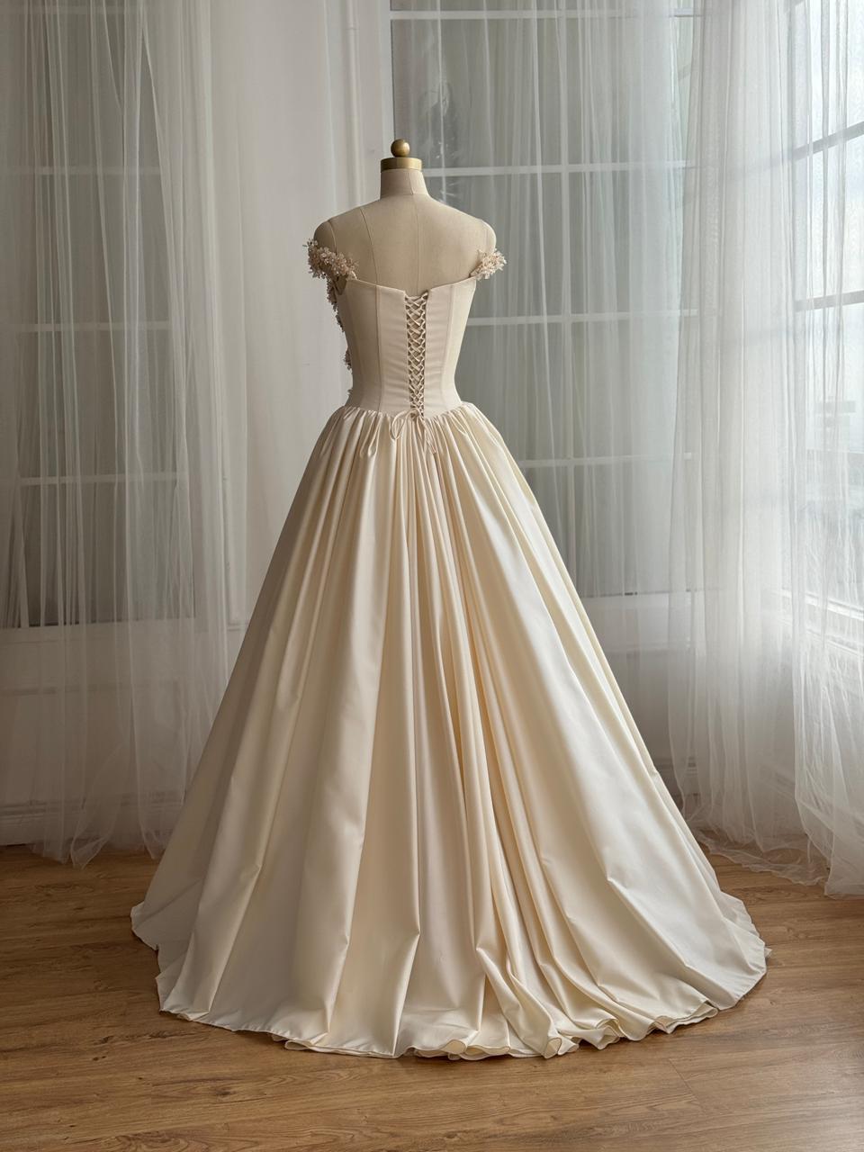 Beige A-Line gown with off the shoulder sleeves and embroidery