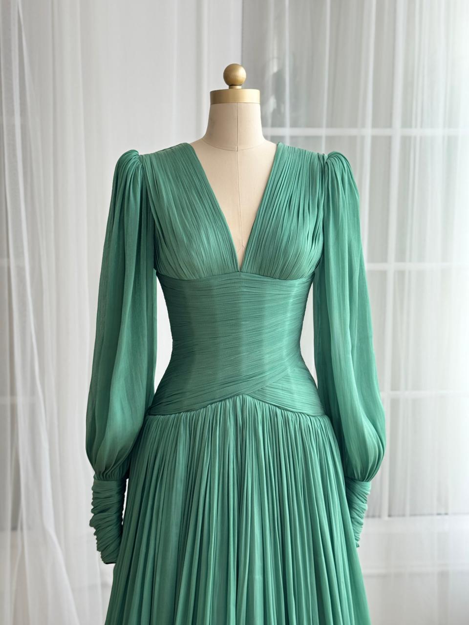 Green A-Line gown with long sleeves and. v-neck