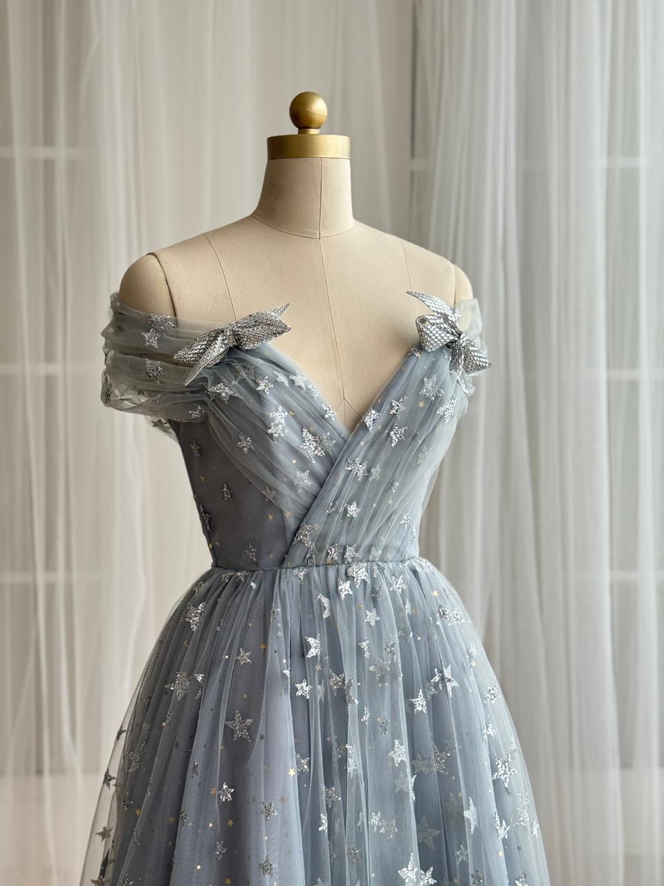 Silver midi dress with starry tulle fabric, embroidered bows, v-neck and off the shoulder sleeves