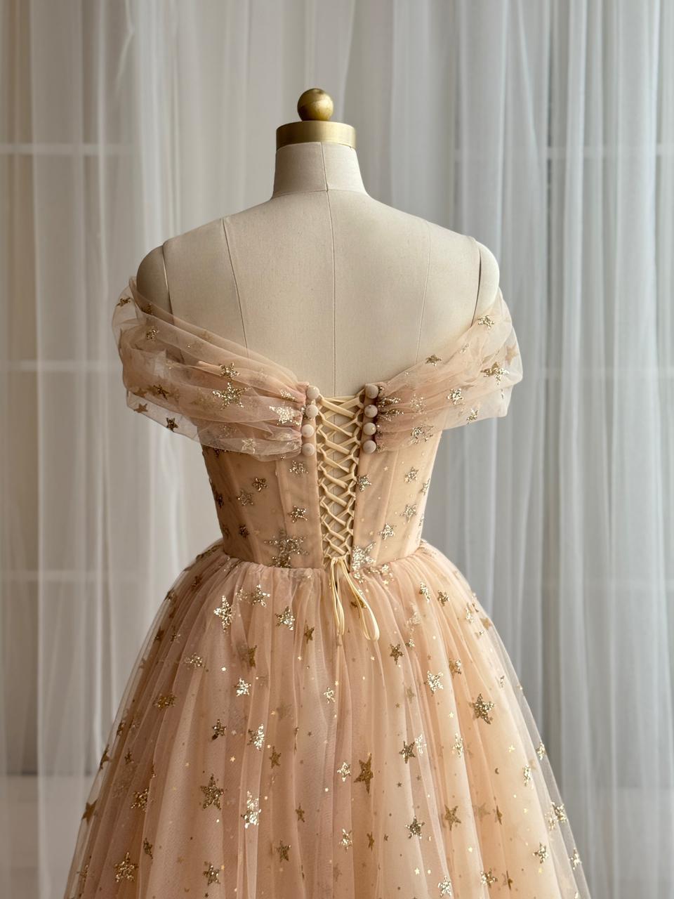 Gold midi dress with off the shoulder sleeves and starry tulle fabric