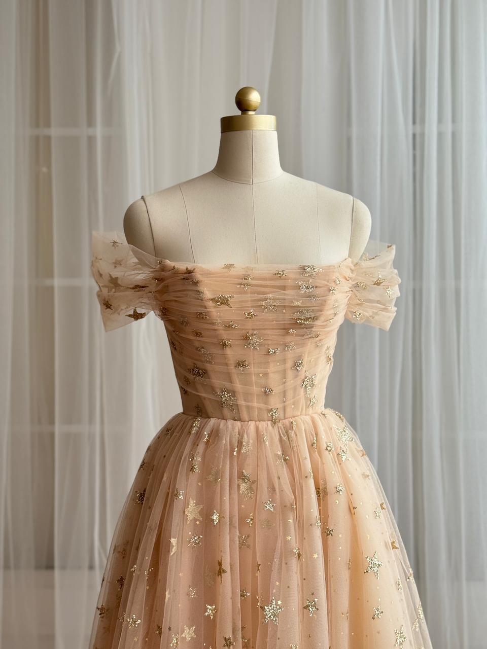 Gold midi dress with off the shoulder sleeves and starry tulle fabric