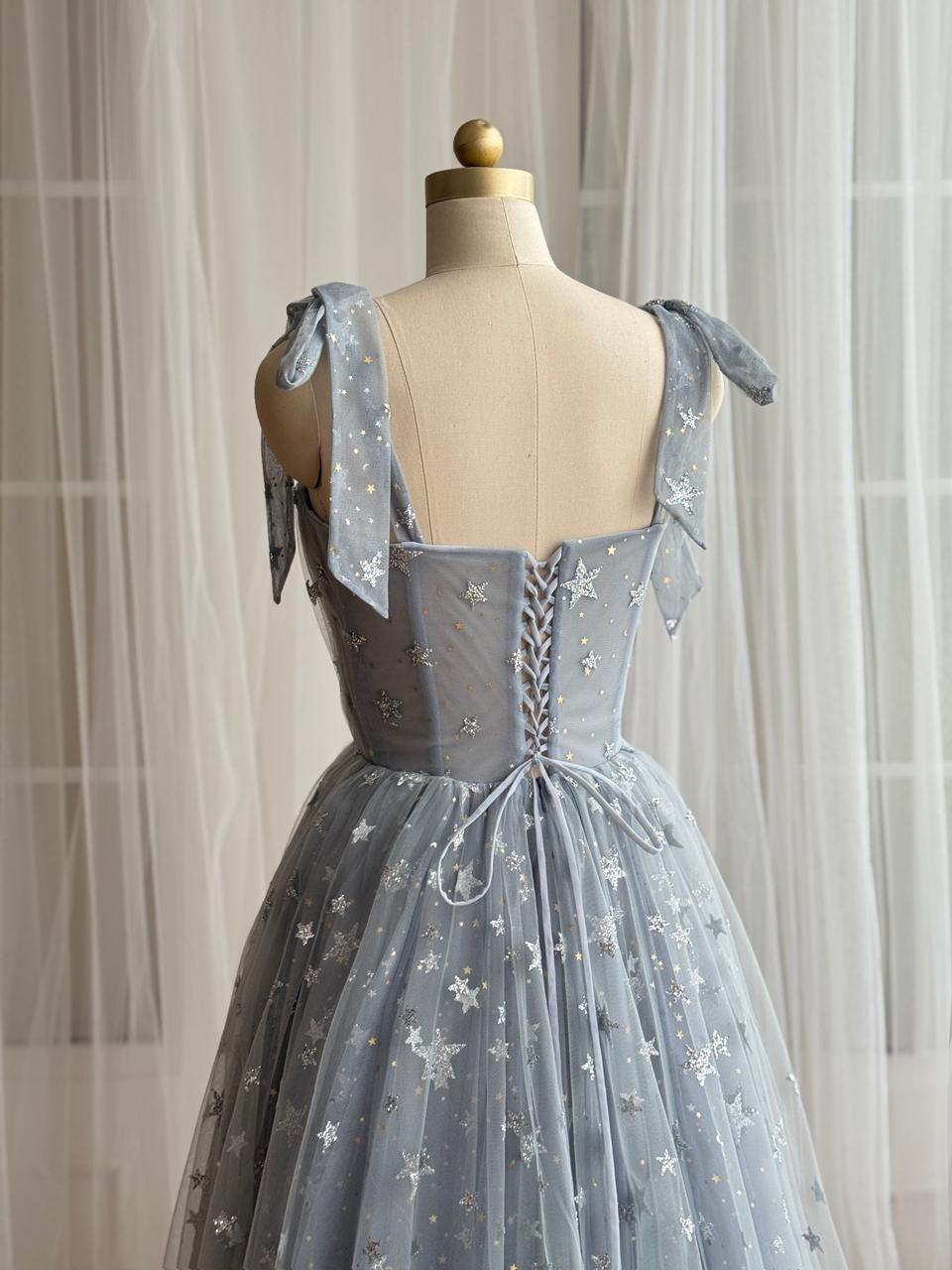 Silver A-Line gown with bow straps, embroidered bow and starry fabric