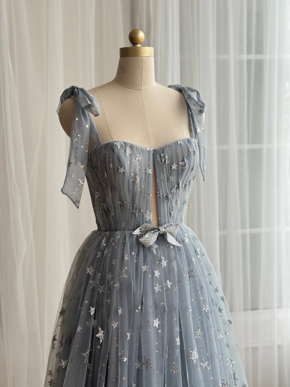 Silver A-Line gown with bow straps, embroidered bow and starry fabric