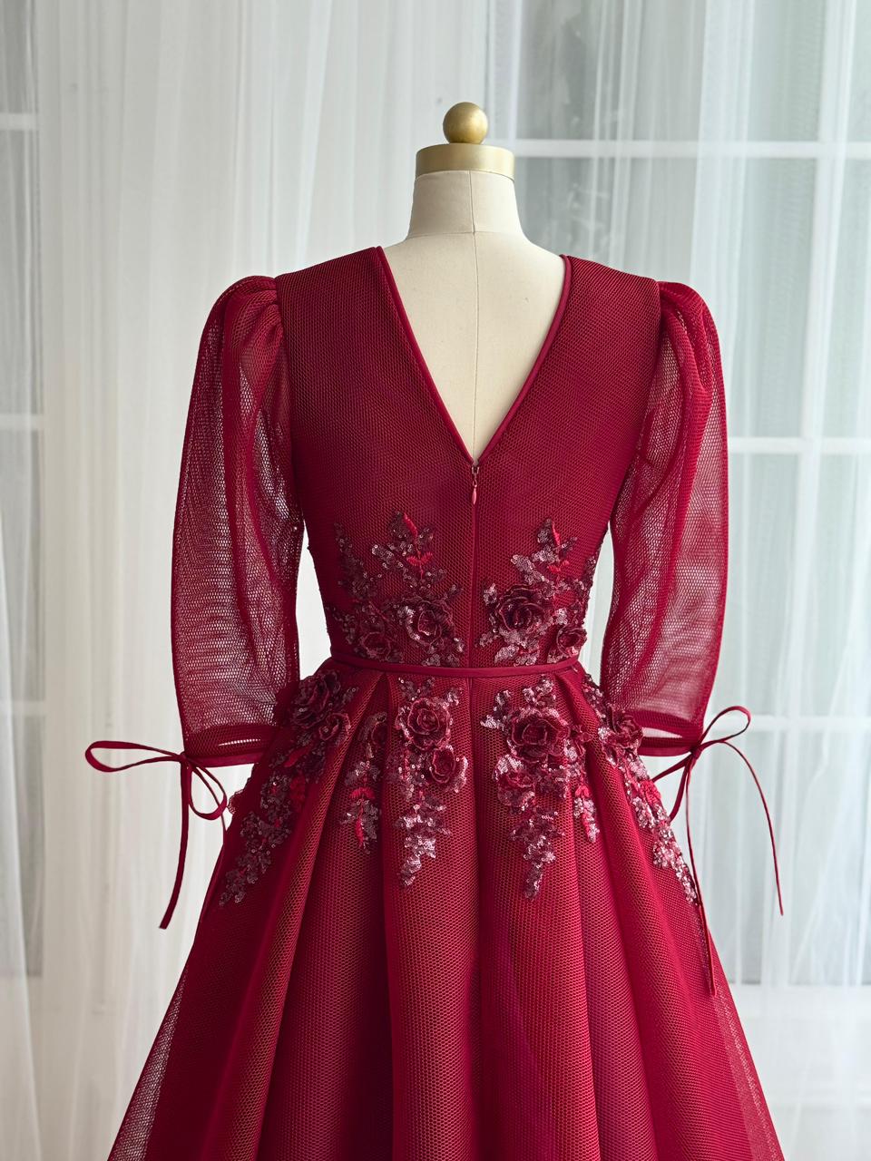 Red A-Line gown with long sleeves, v-neck and embroidery