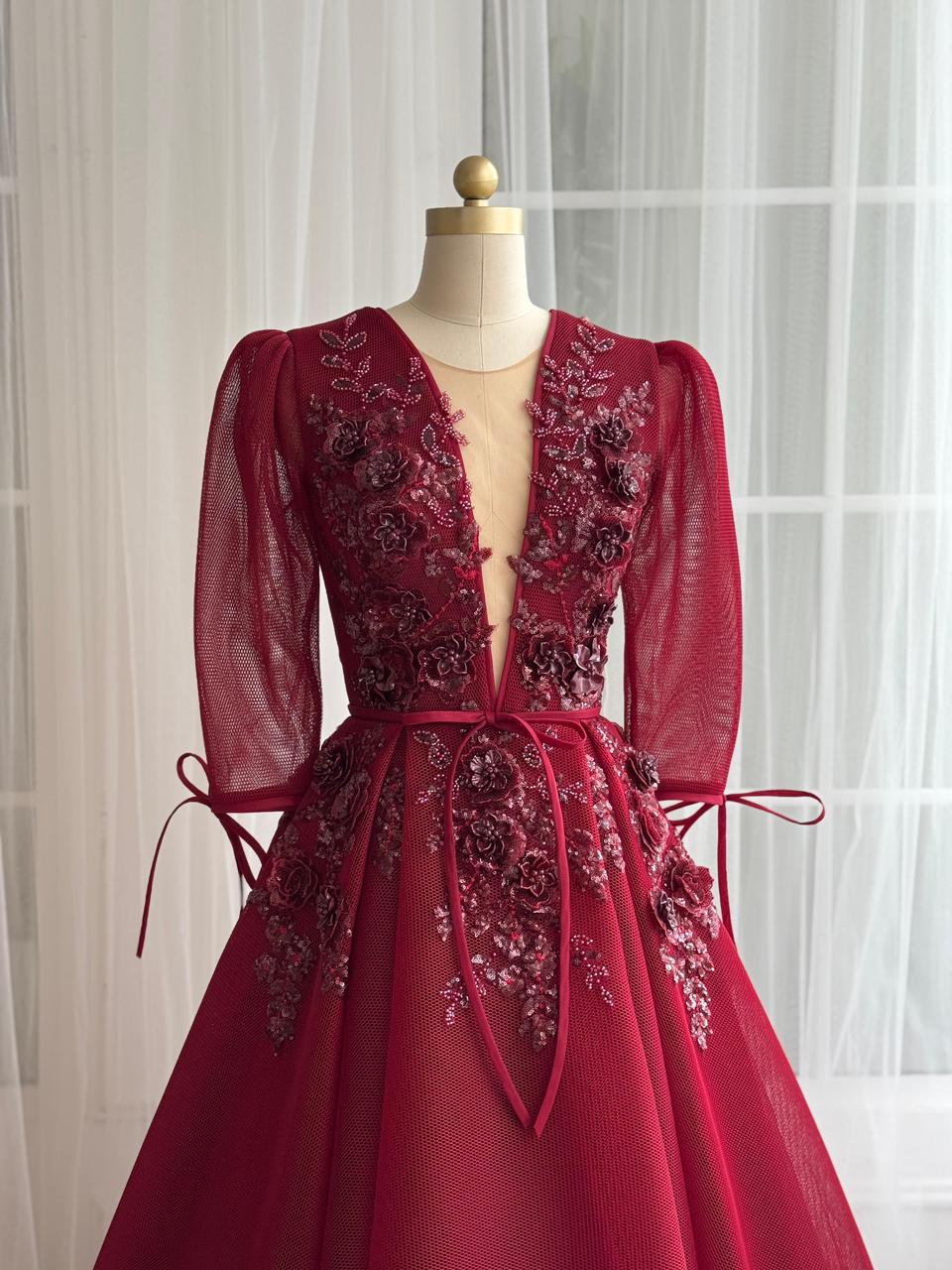 Red A-Line gown with long sleeves, v-neck and embroidery
