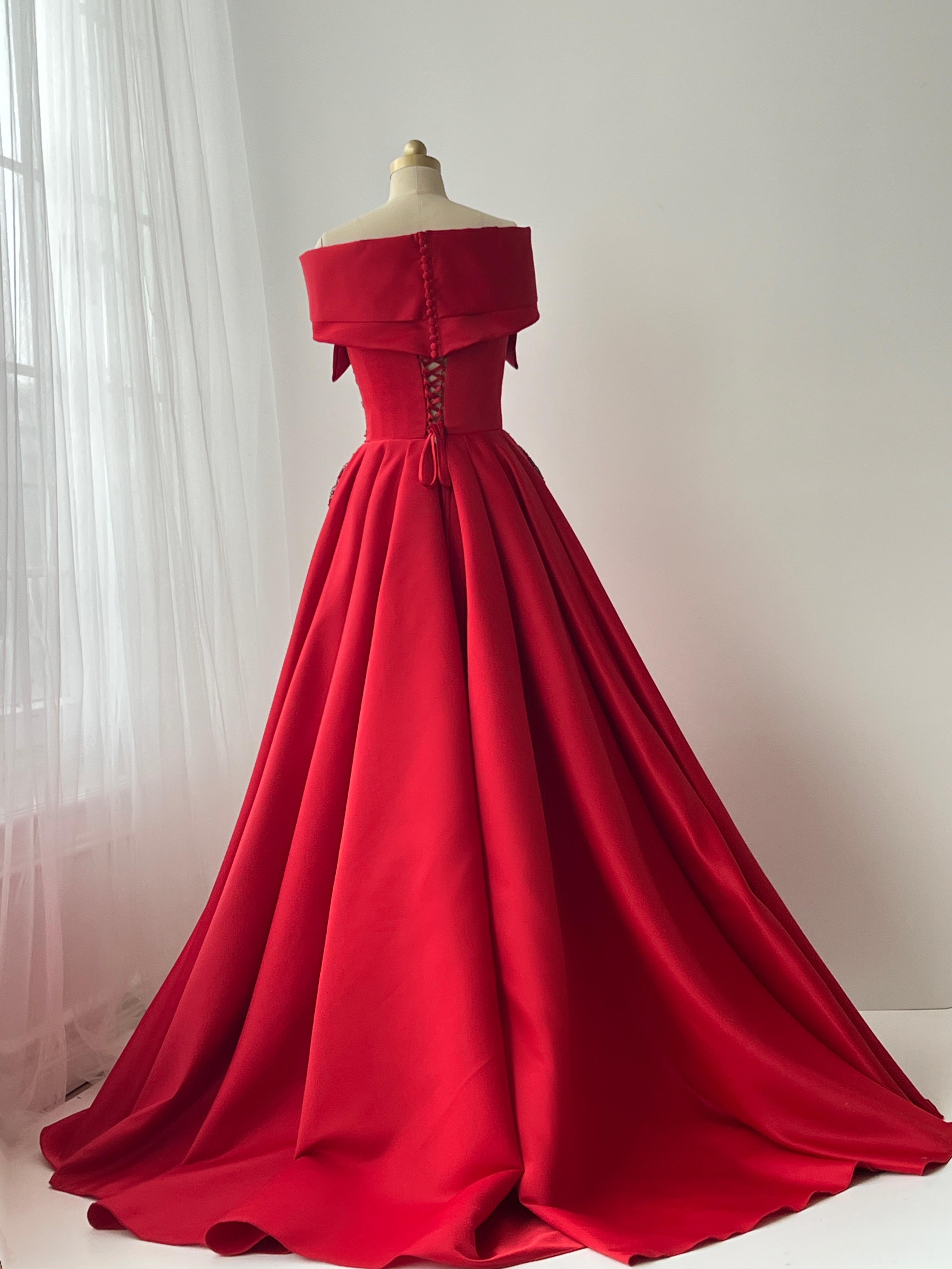 Red A-Line gown with off the shoulder sleeves and embroidery