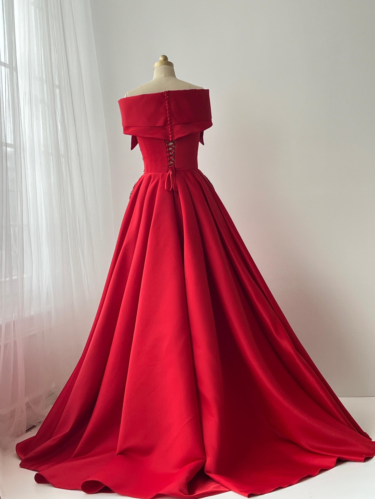 Red A-Line gown with off the shoulder sleeves and embroidery