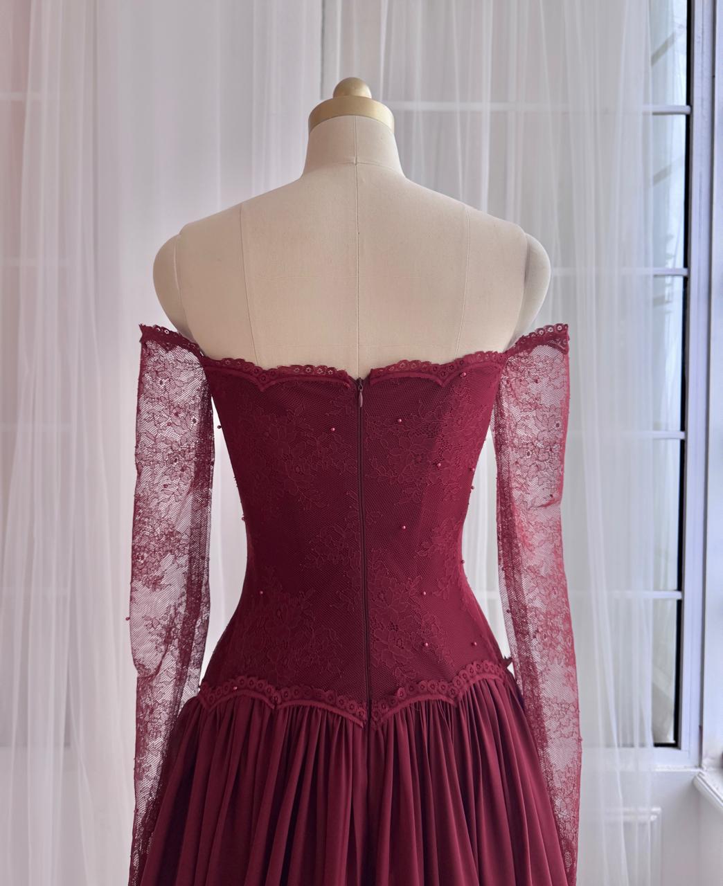 Red A-Line gown with long off the shouler sleeves and lace