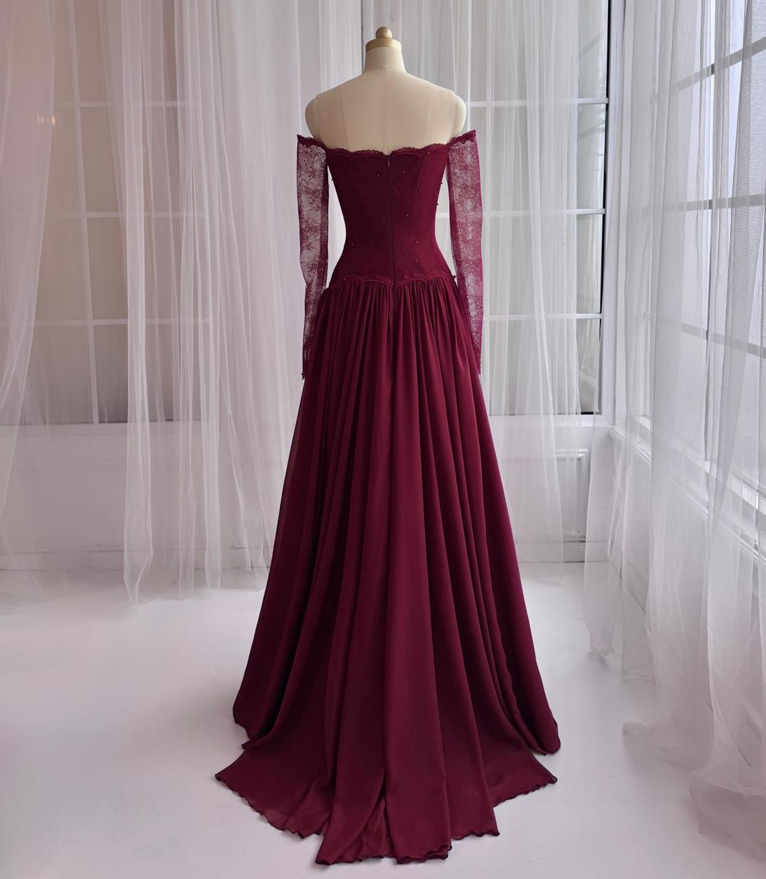 Red A-Line gown with long off the shouler sleeves and lace