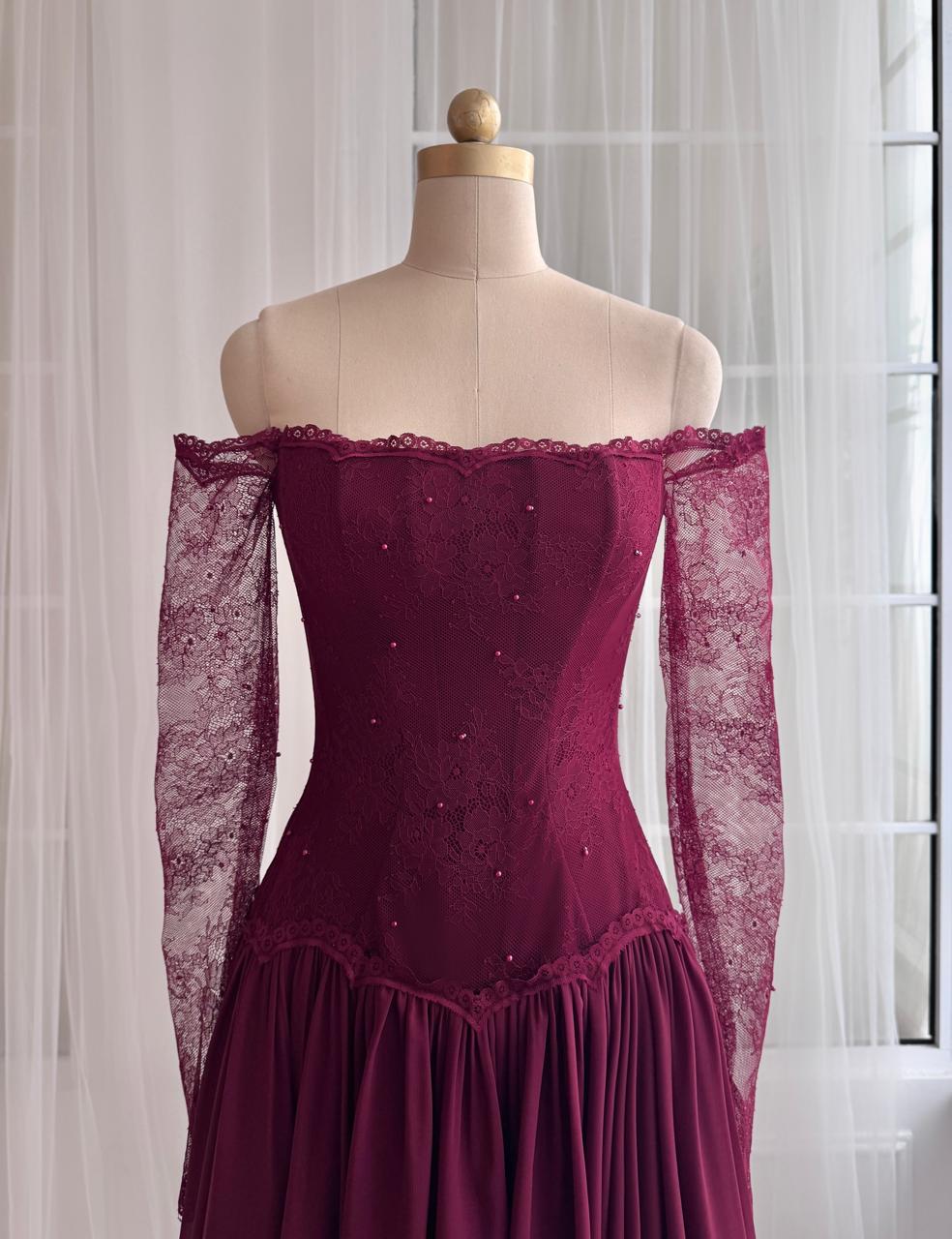 Red A-Line gown with long off the shouler sleeves and lace