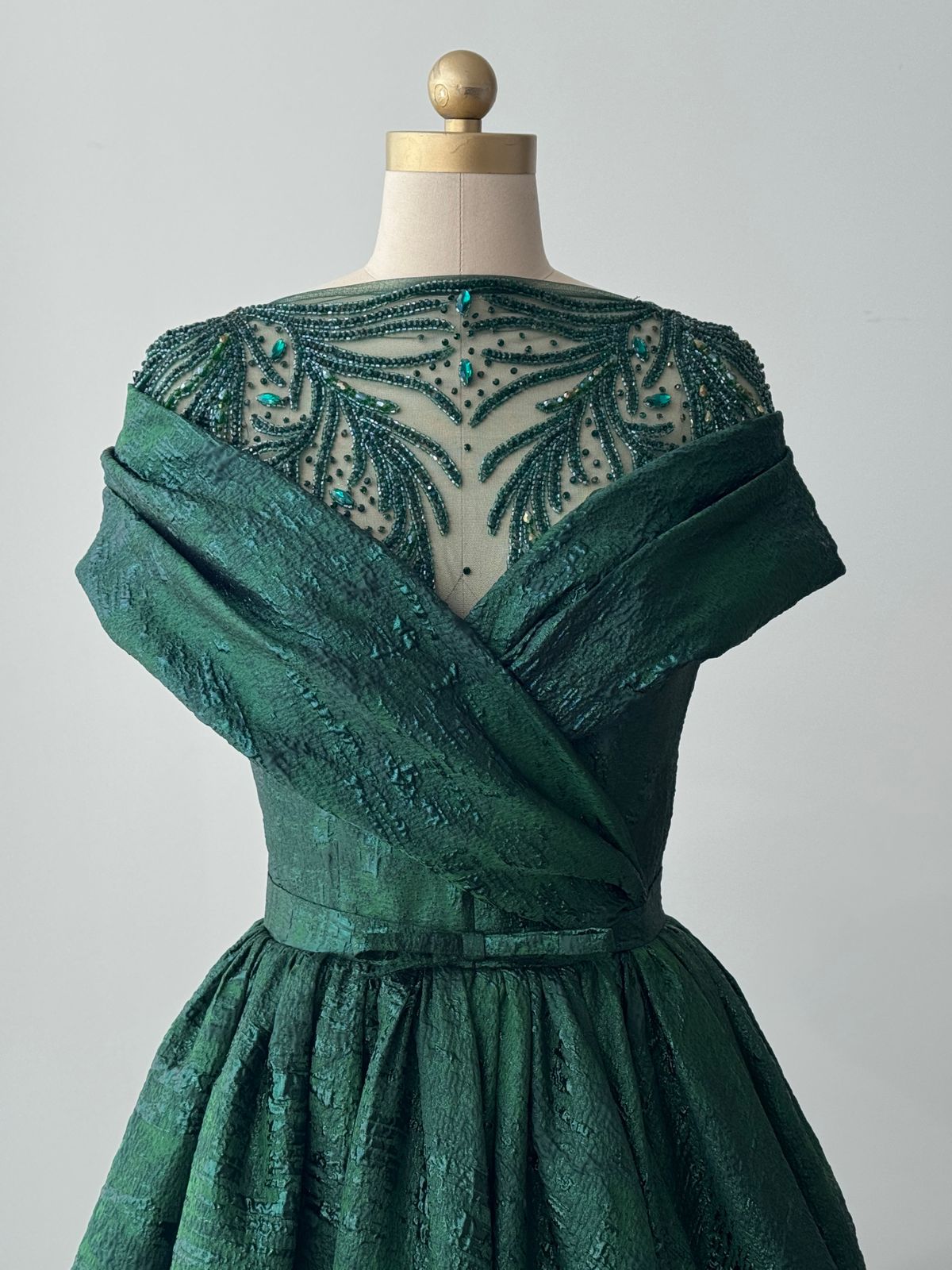 Green A-Line gown with shawl, short sleeves and brocade fabric