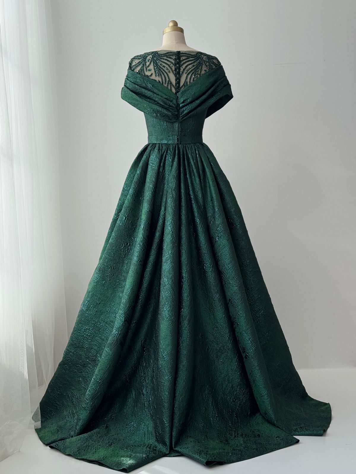 Green A-Line gown with shawl, short sleeves and brocade fabric
