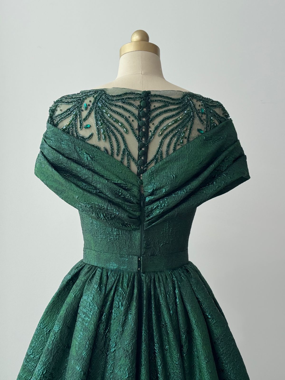 Green A-Line gown with shawl, short sleeves and brocade fabric