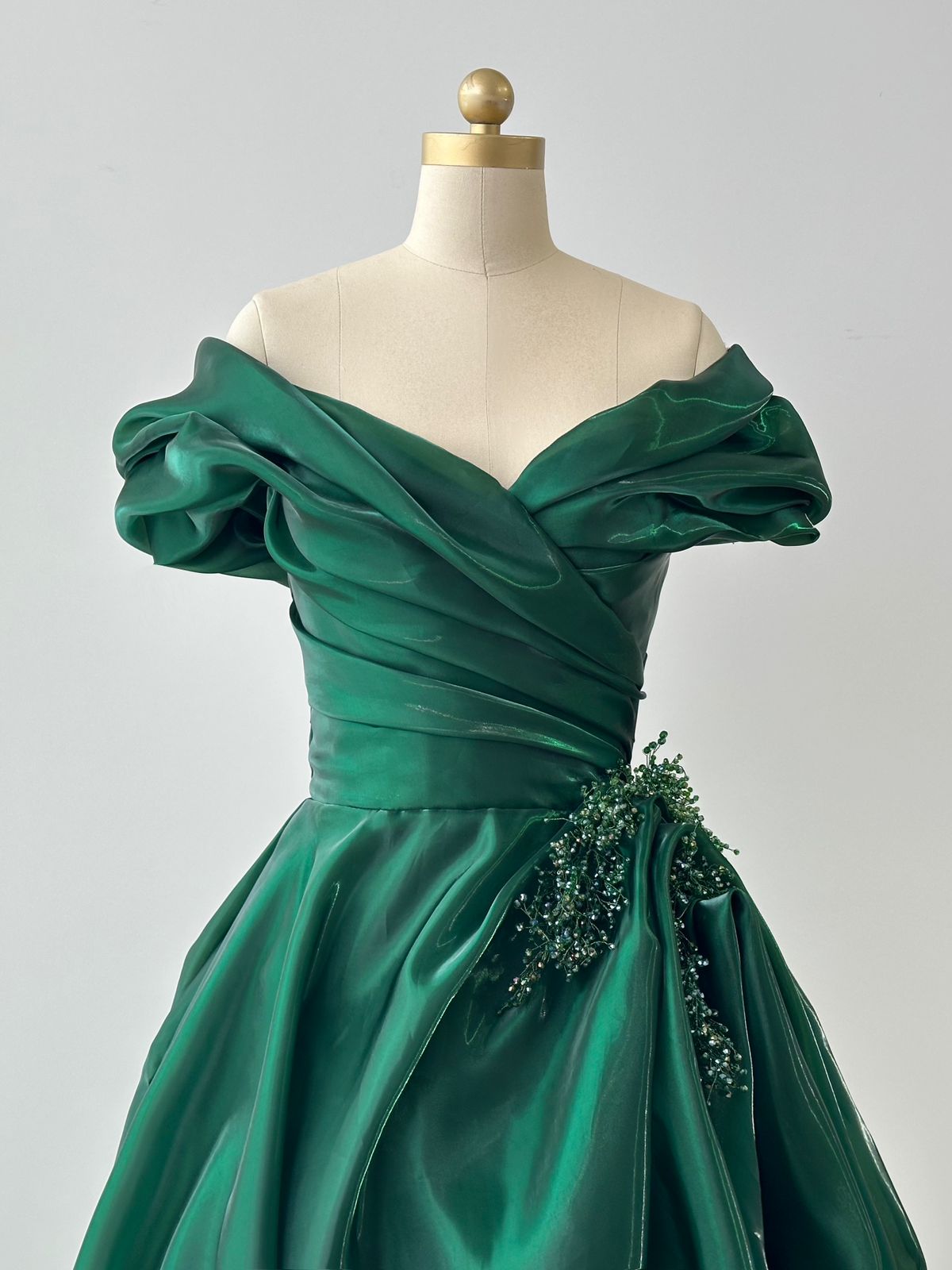 Green A-Line dress with off the shoulder sleeves, taffeta fabric and embroidery